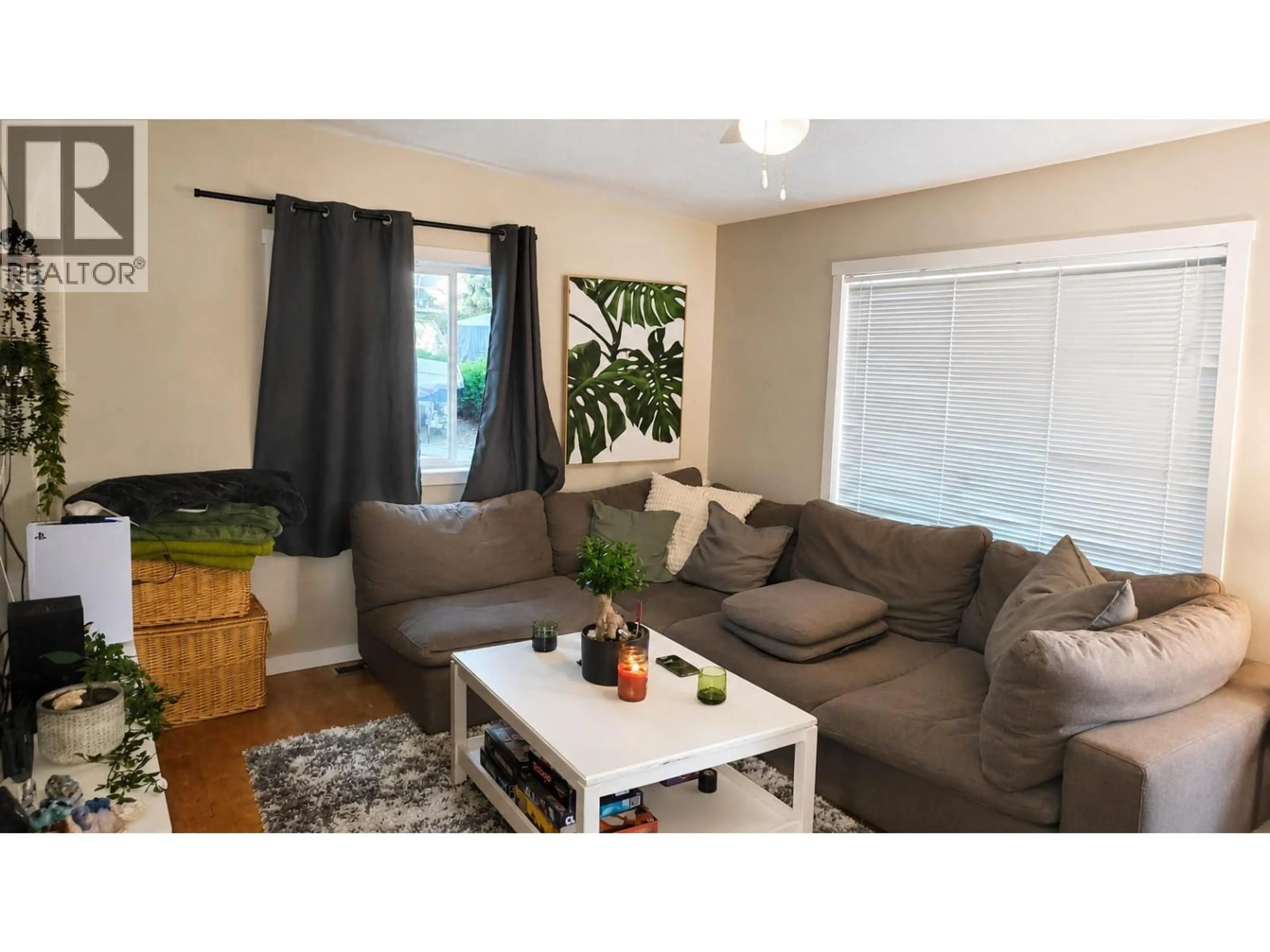 Living room with furniture, wood/laminate floor for 79 - 9020 JIM BAILEY ROAD, Kelowna British Columbia V4V1E5