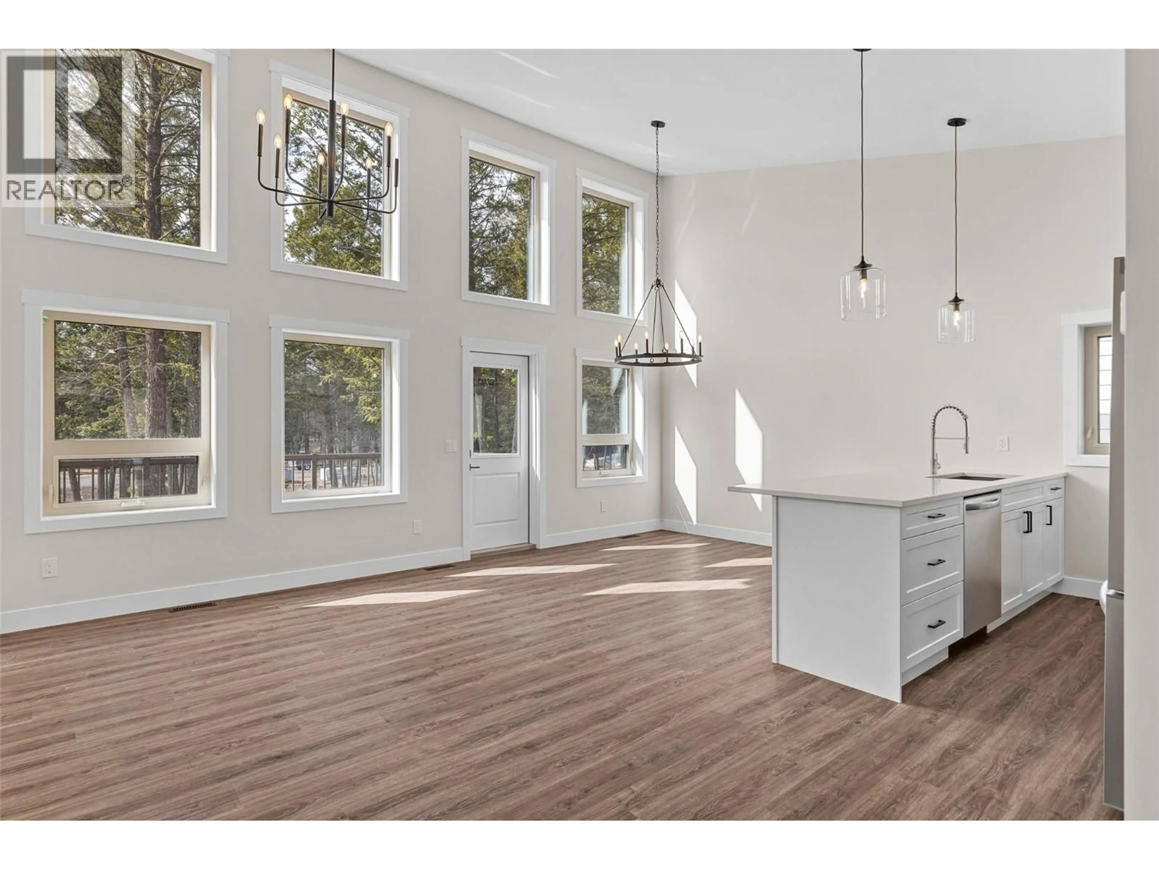 Open concept kitchen, wood/laminate floor for 1210 SWANSEA CRESCENT, Windermere British Columbia V0B1J0