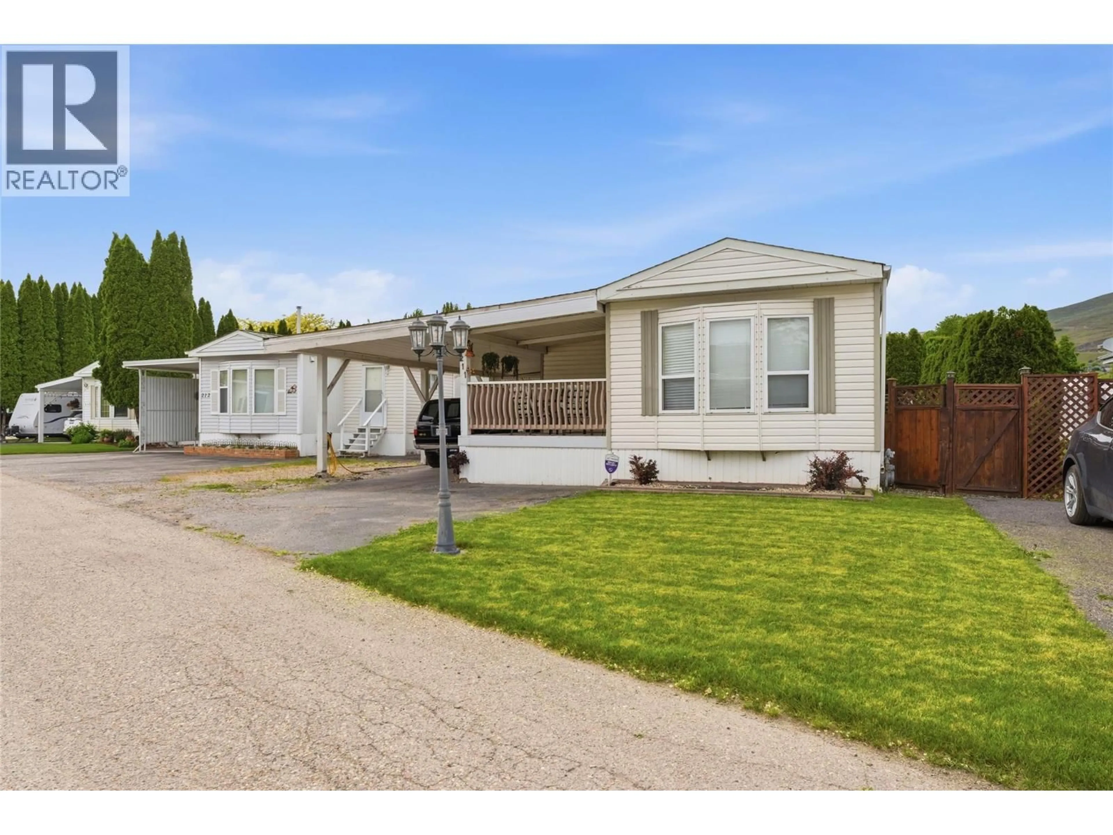 Home with vinyl exterior material, street for 211 - 6710 TRONSON ROAD, Vernon British Columbia V1H1X6