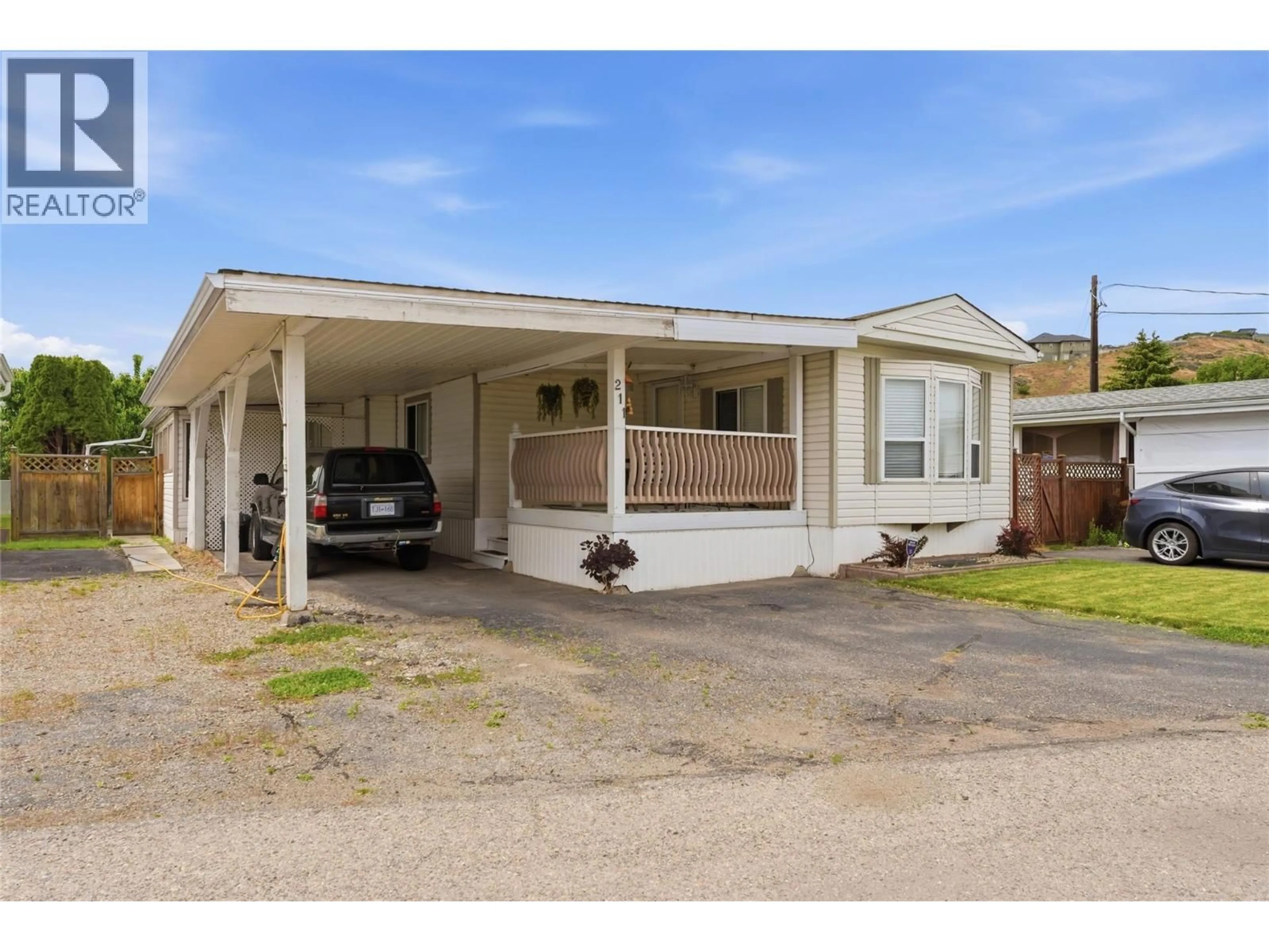 Home with vinyl exterior material, street for 211 - 6710 TRONSON ROAD, Vernon British Columbia V1H1X6