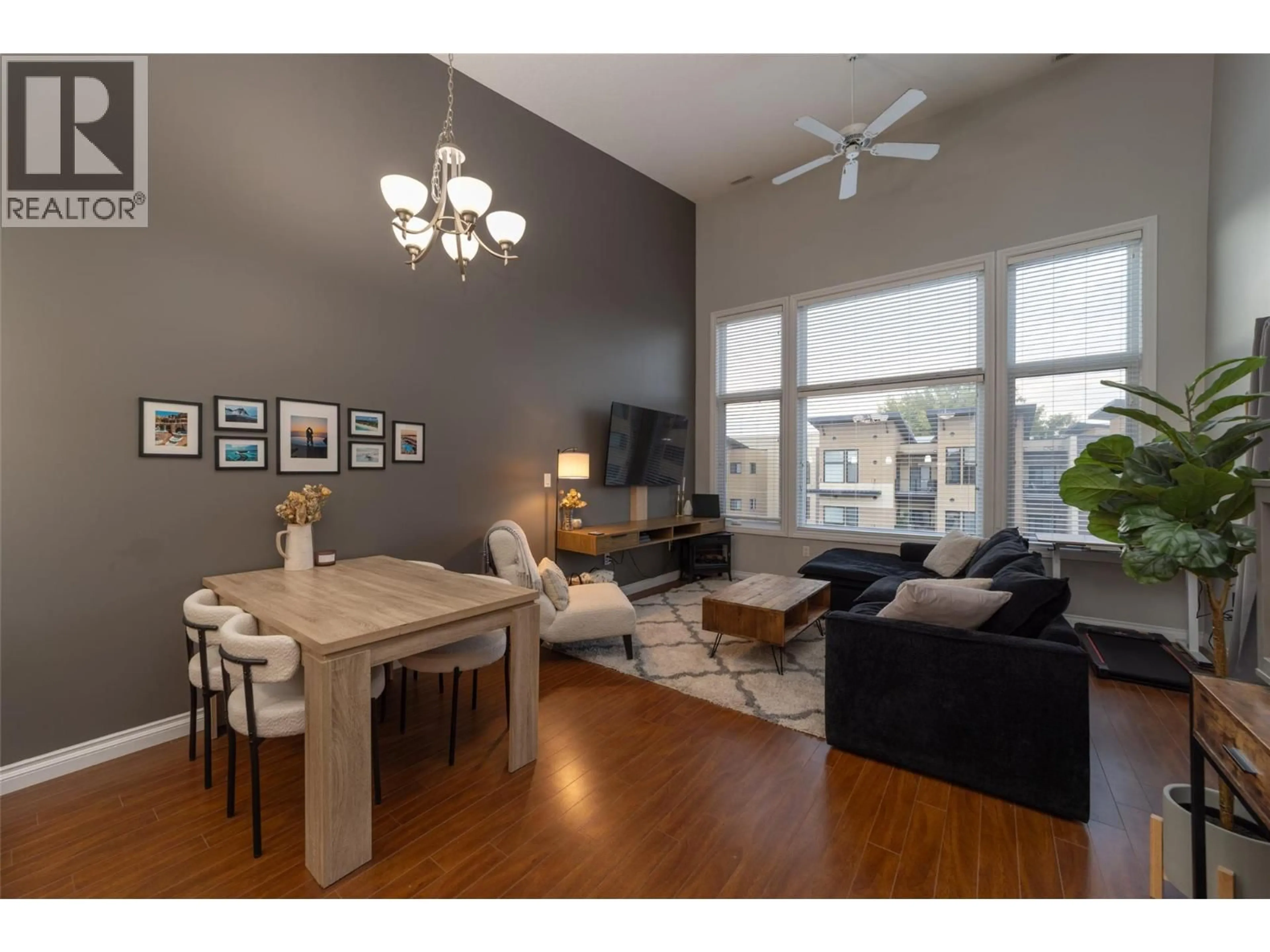 Living room with furniture, wood/laminate floor for 404 - 3313 WILSON STREET, Penticton British Columbia V2A8J3