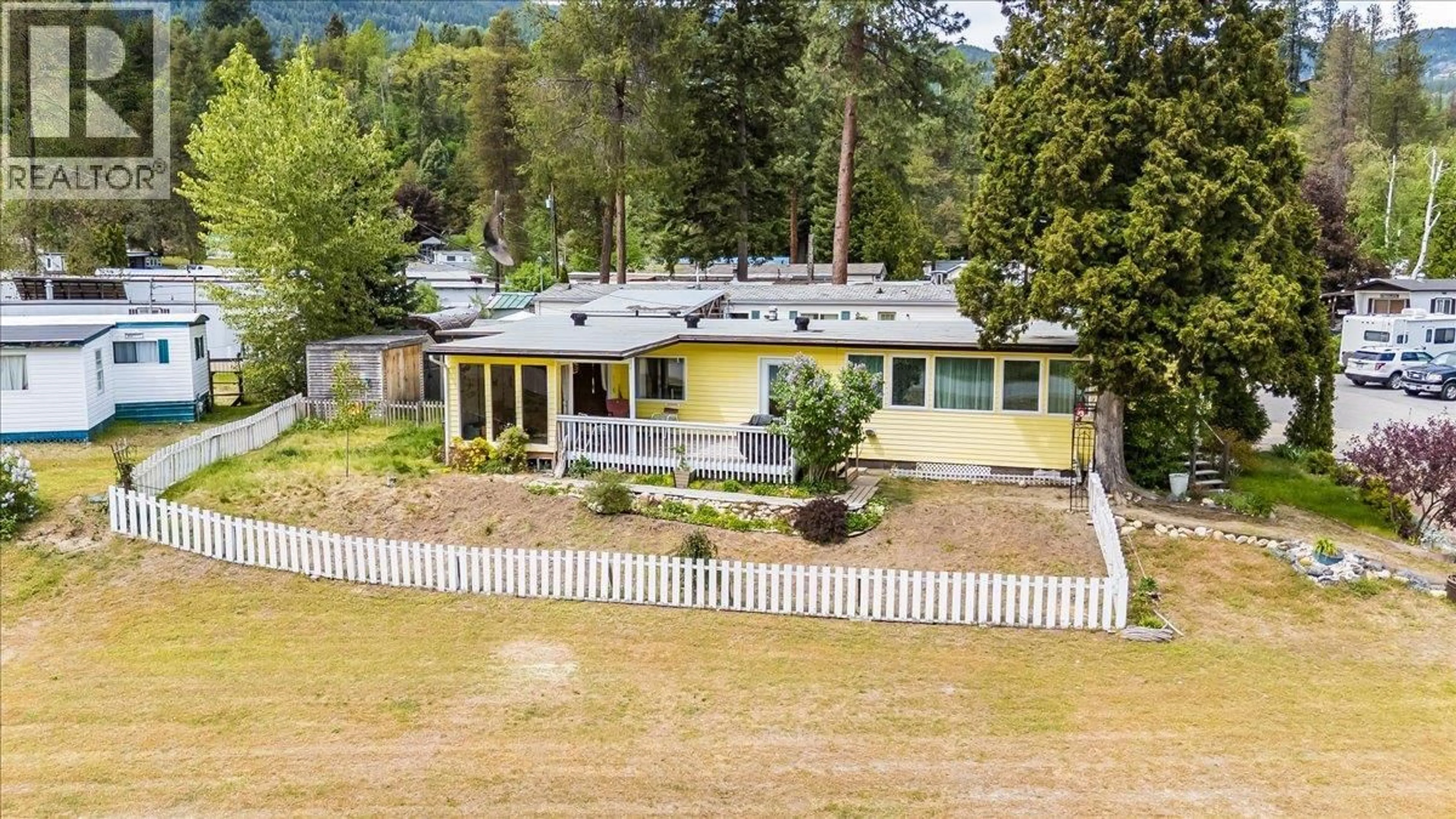 A pic from outside/outdoor area/front of a property/back of a property/a pic from drone, mountain view for 53 - 500 16TH AVENUE, Genelle British Columbia V0G1G0