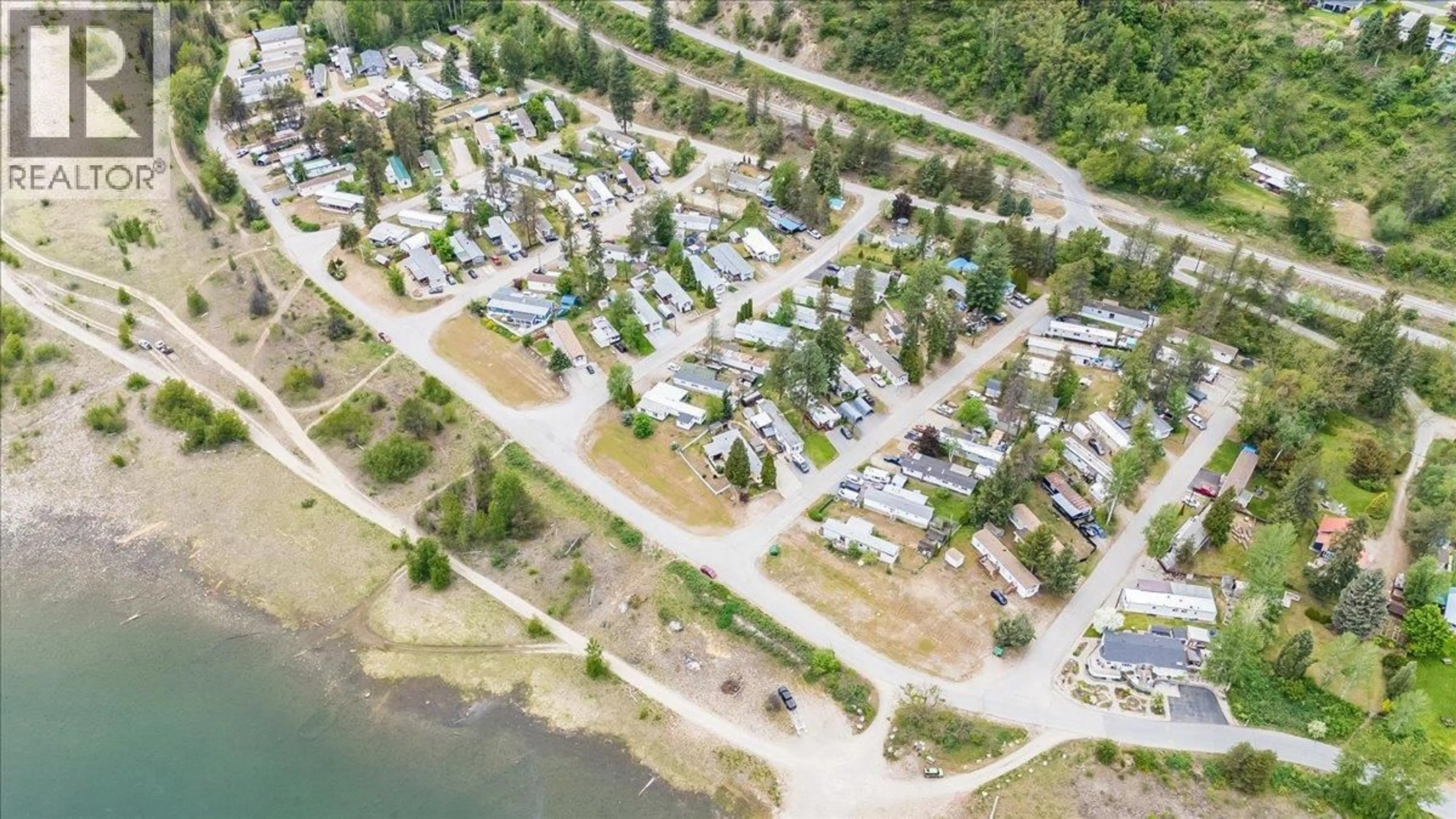 A pic from outside/outdoor area/front of a property/back of a property/a pic from drone, street for 53 - 500 16TH AVENUE, Genelle British Columbia V0G1G0