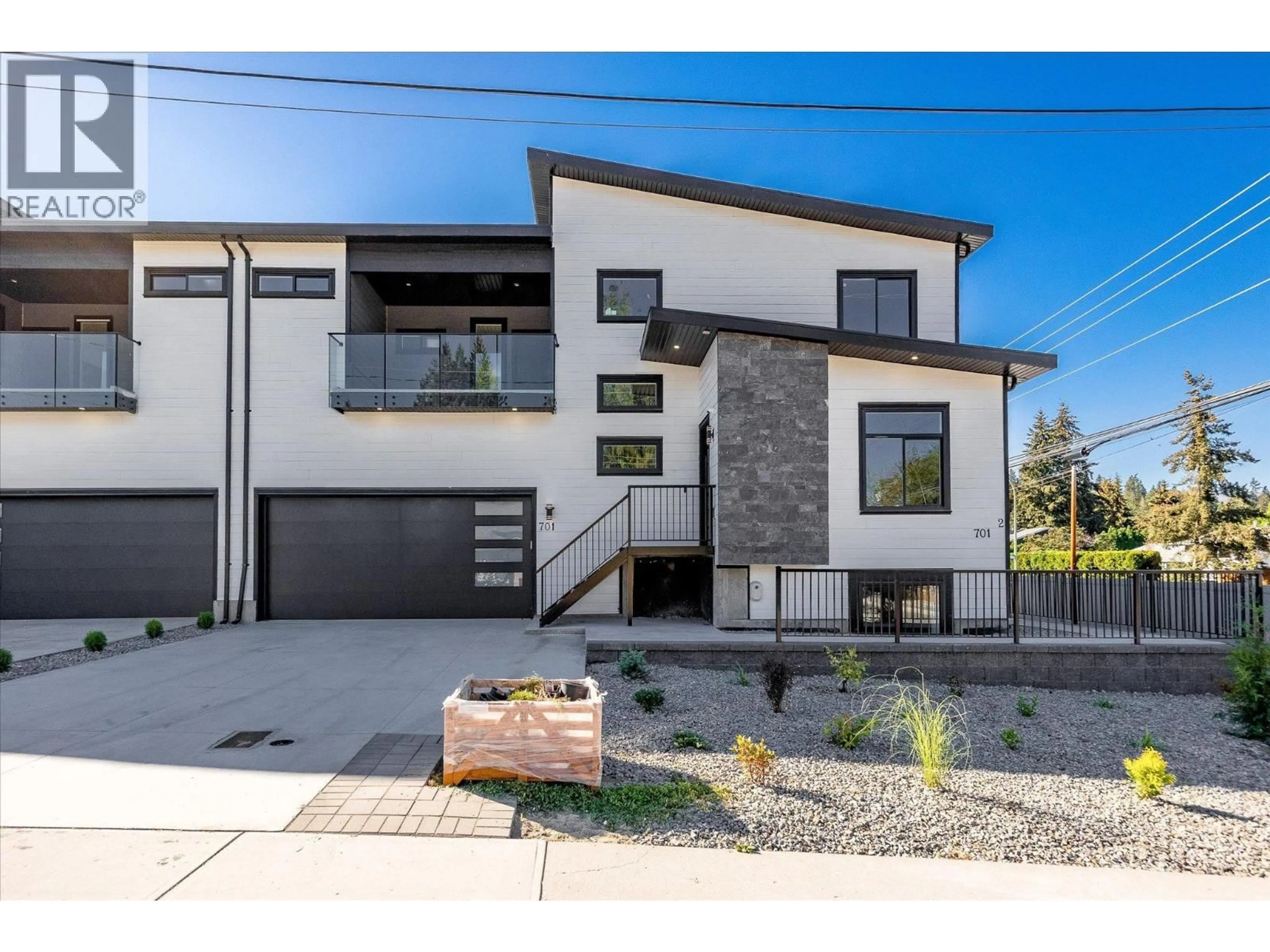 Home with brick exterior material, street for 701 MCCLURE ROAD, Kelowna British Columbia V1W1M2