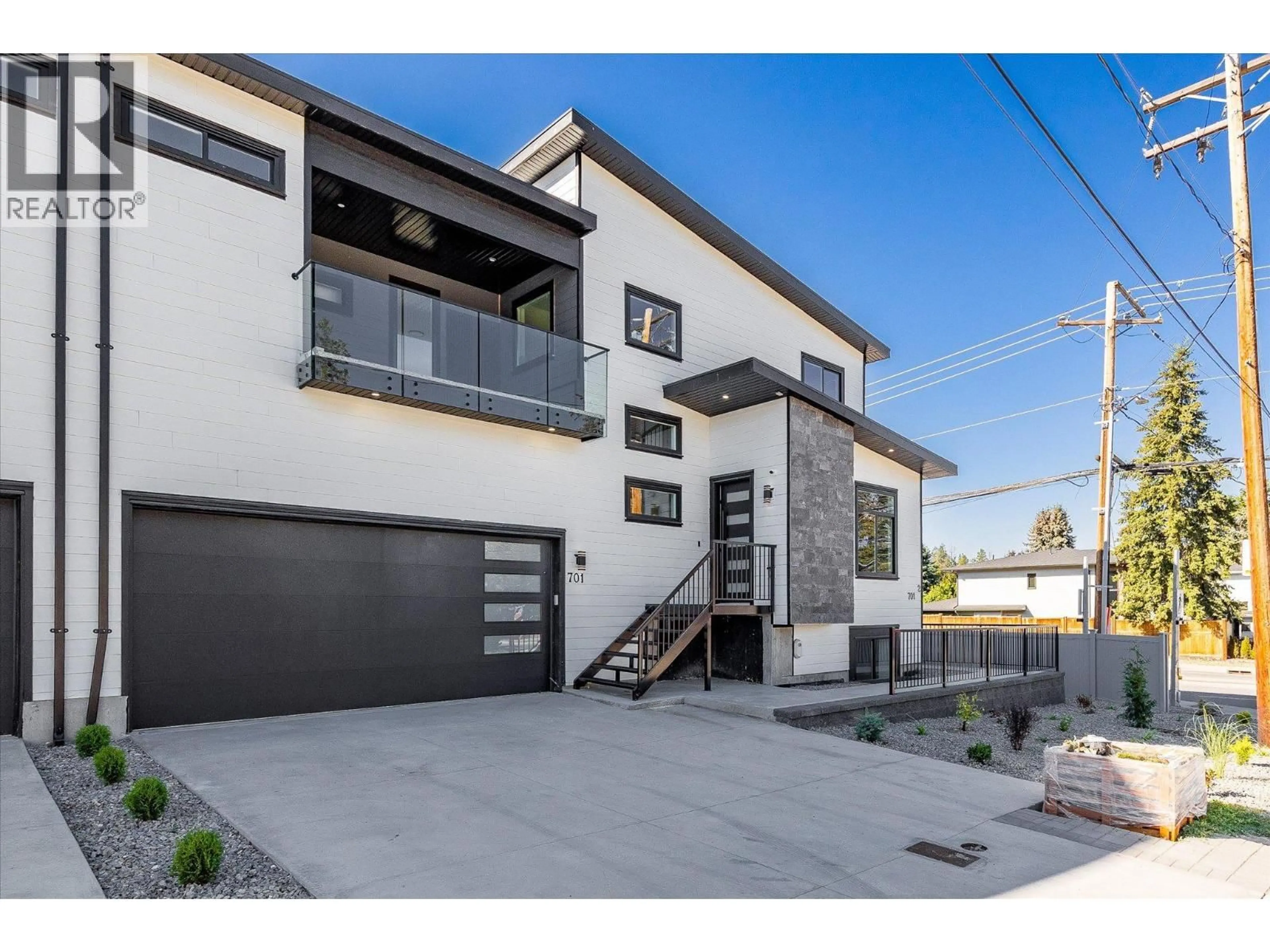 Home with brick exterior material, street for 701 MCCLURE ROAD, Kelowna British Columbia V1W1M2