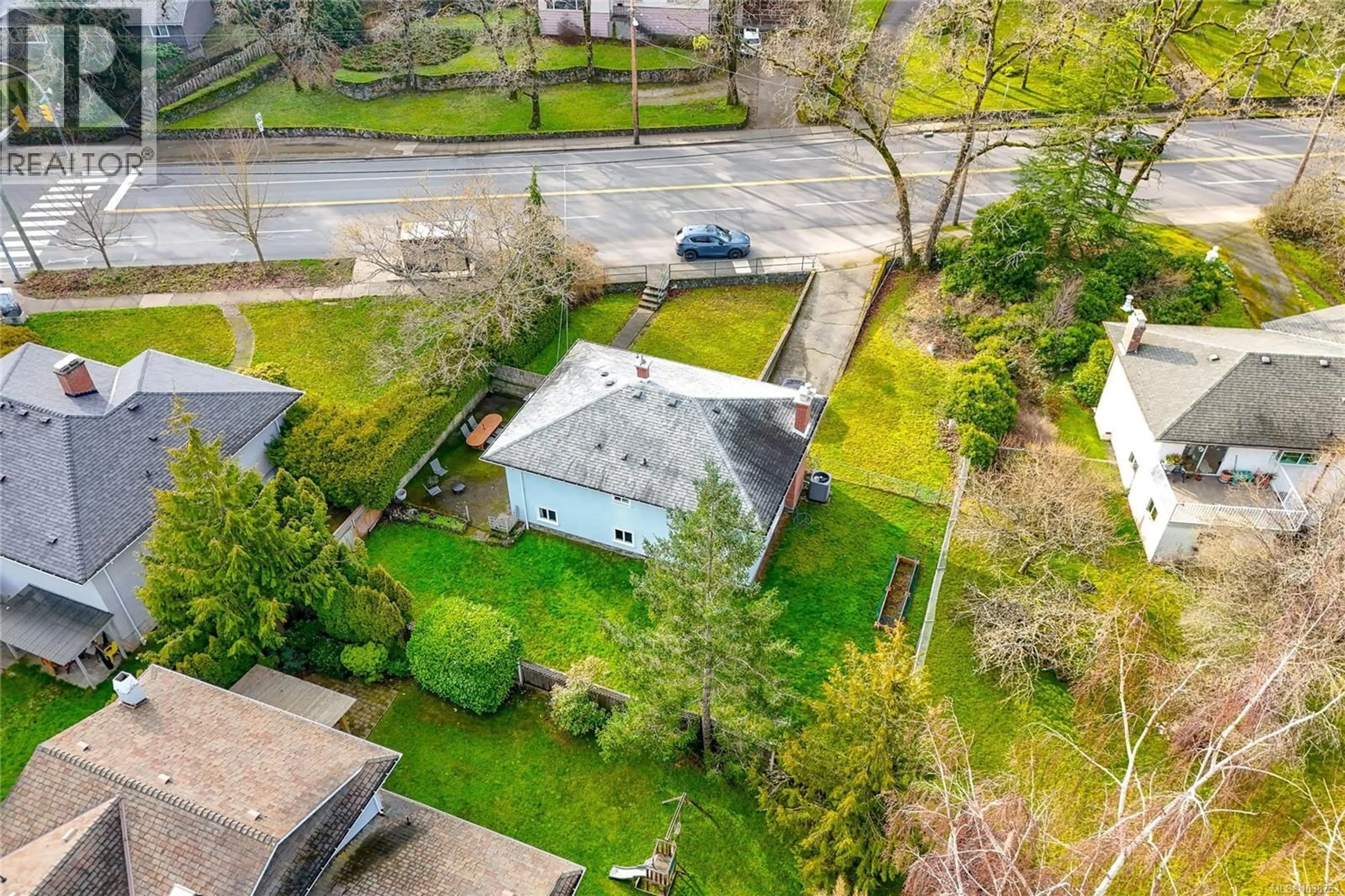 A pic from outside/outdoor area/front of a property/back of a property/a pic from drone, street for 4121 QUADRA STREET, Saanich British Columbia V8X1L1