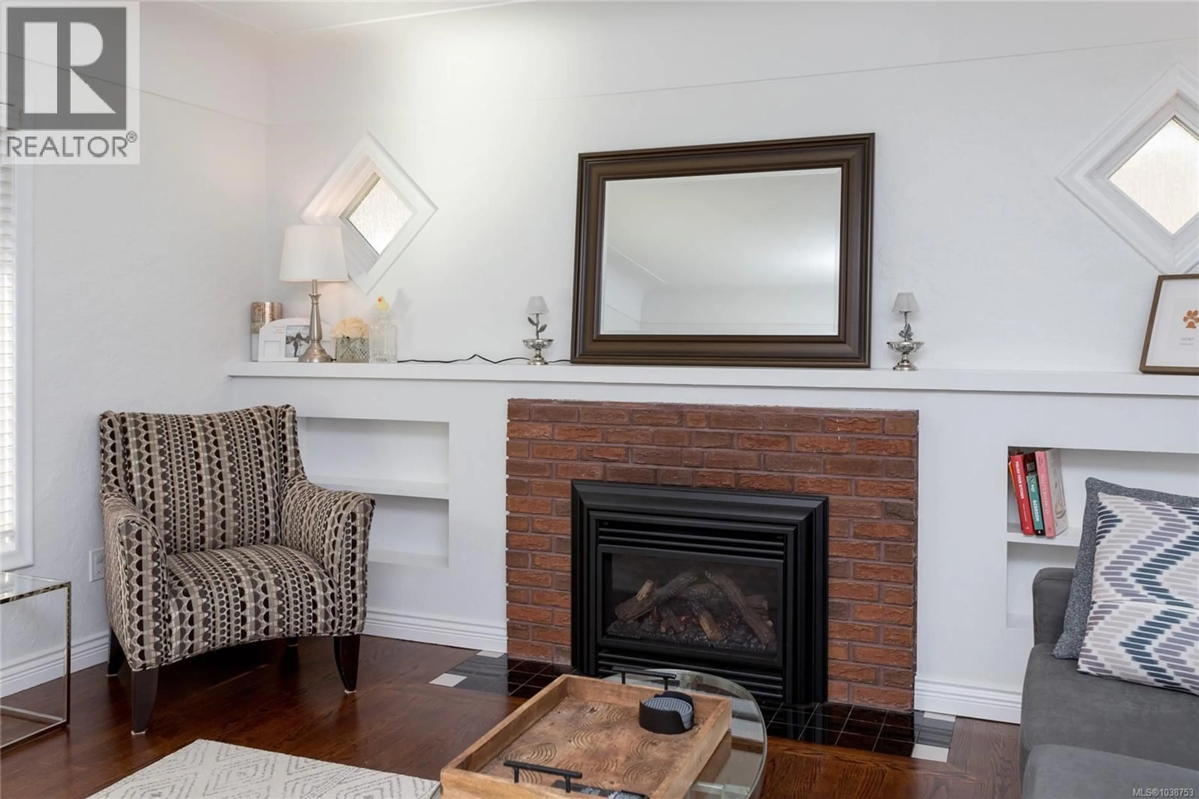 Living room with furniture, wood/laminate floor for 4121 QUADRA STREET, Saanich British Columbia V8X1L1