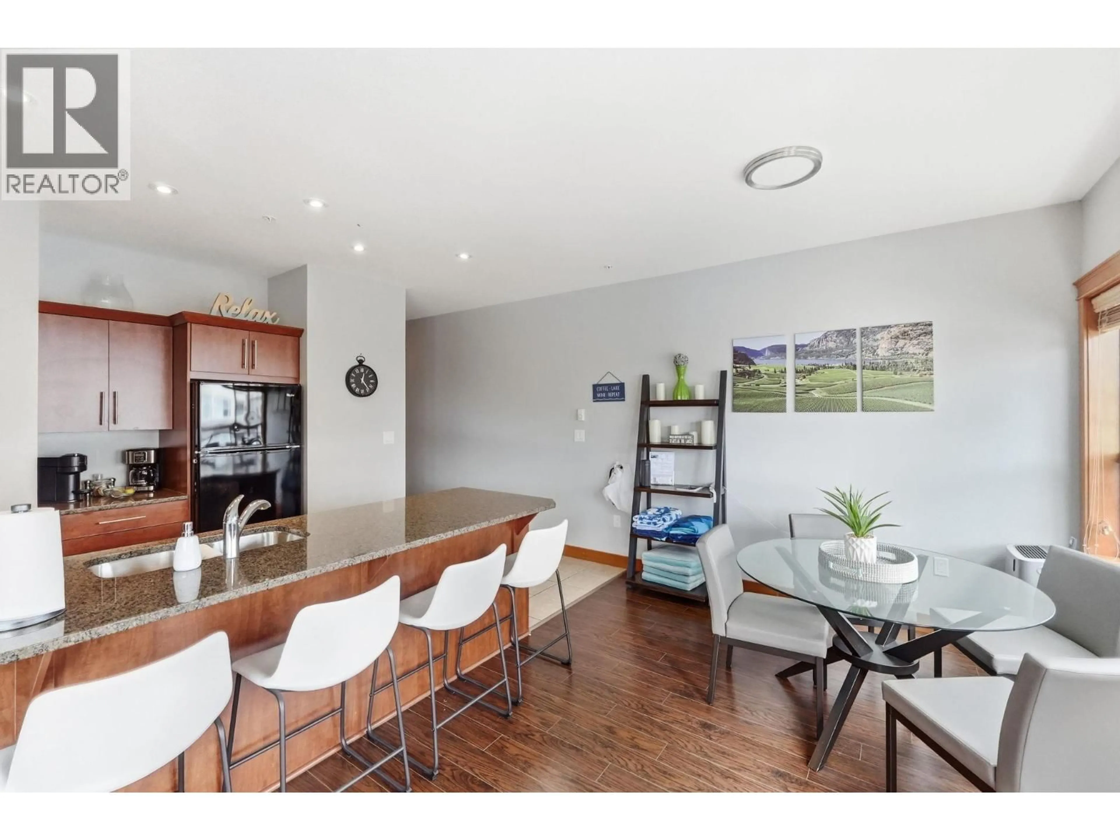 Open concept kitchen, wood/laminate floor for 301 - 93 WINNIPEG STREET, Penticton British Columbia V2A5L9