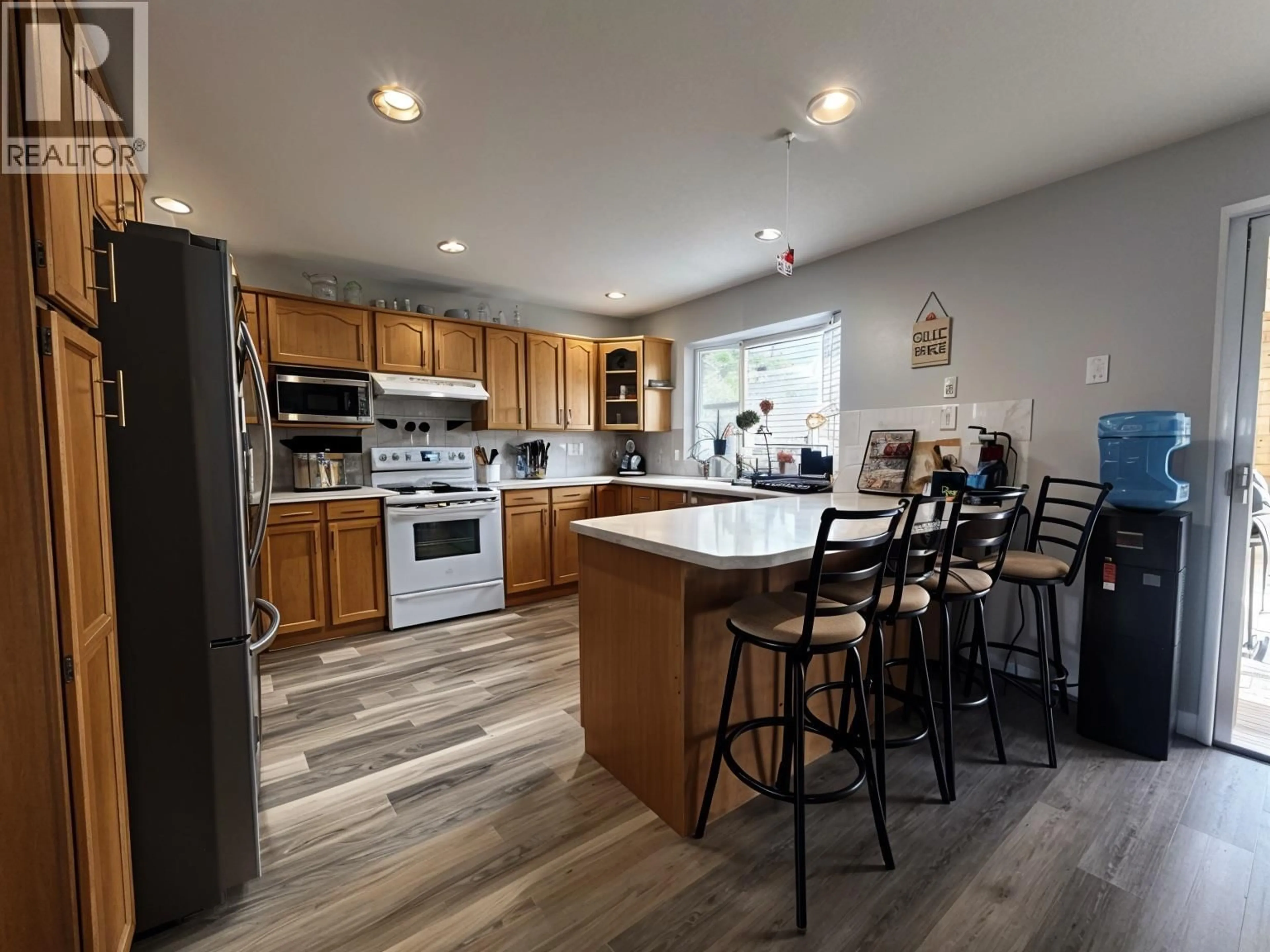 Open concept kitchen, wood/laminate floor for 2024 MOUNTAIN VIEW AVENUE, Lumby British Columbia V0E2G0