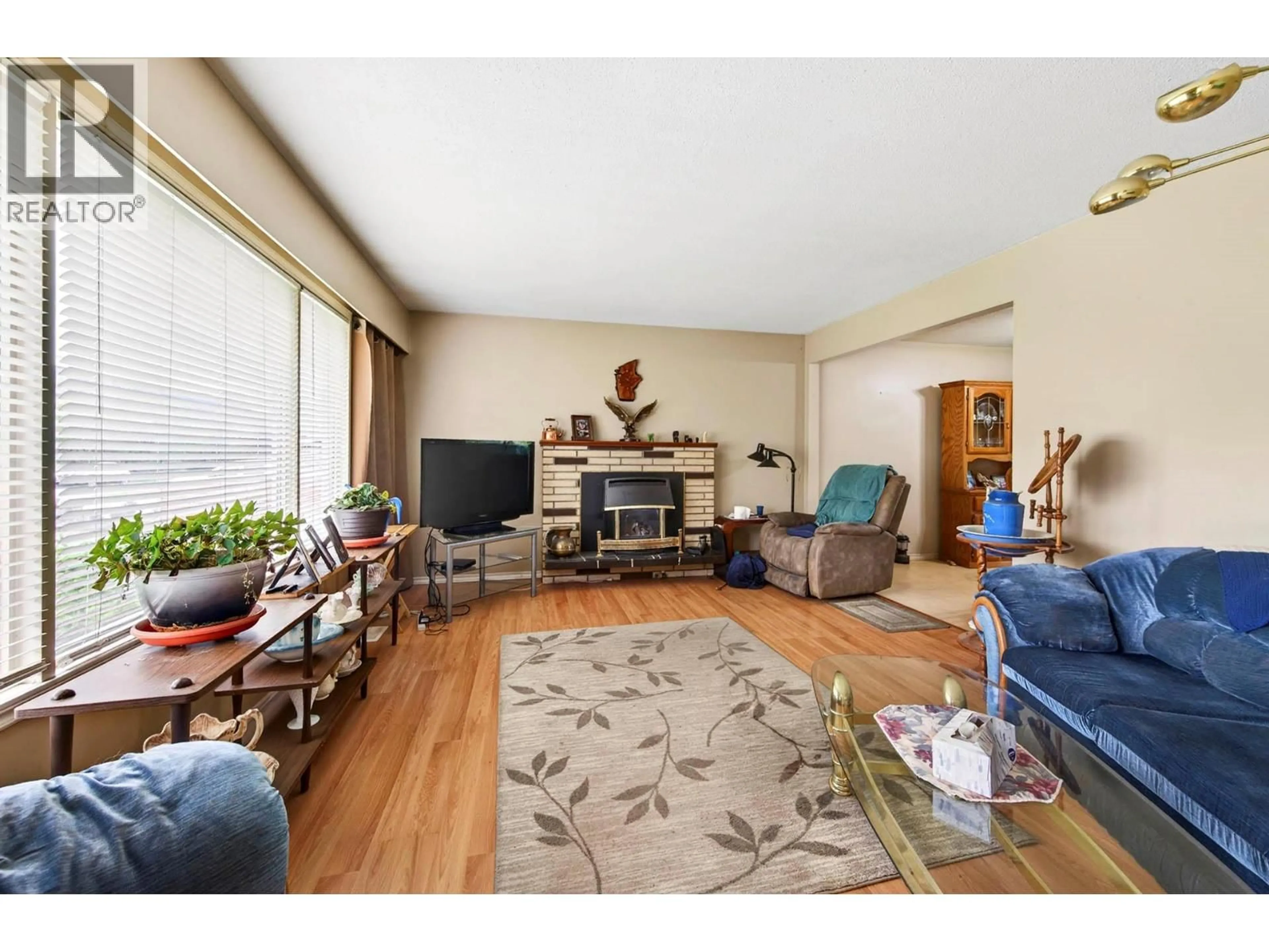 Living room with furniture, wood/laminate floor for 6452 FURRER ROAD, Kamloops British Columbia V2C4V6