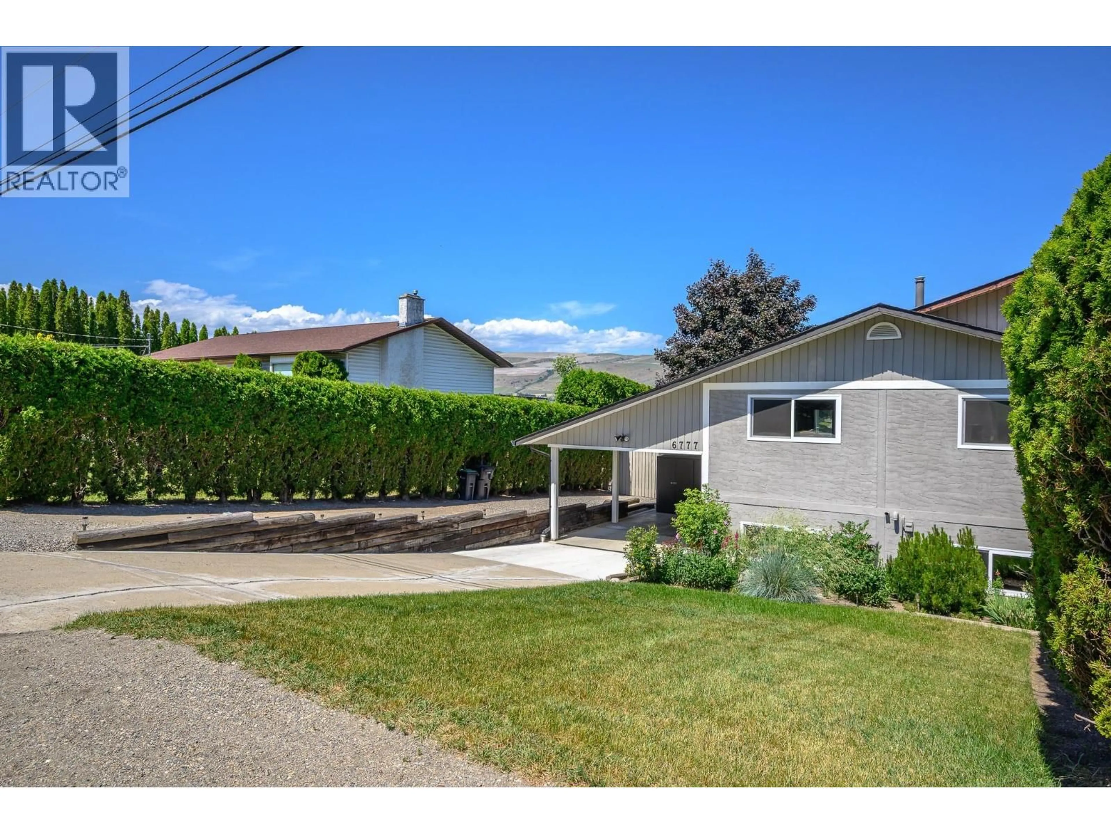 A pic from outside/outdoor area/front of a property/back of a property/a pic from drone, street for 6777 LONGACRE DRIVE, Vernon British Columbia V1H1J1