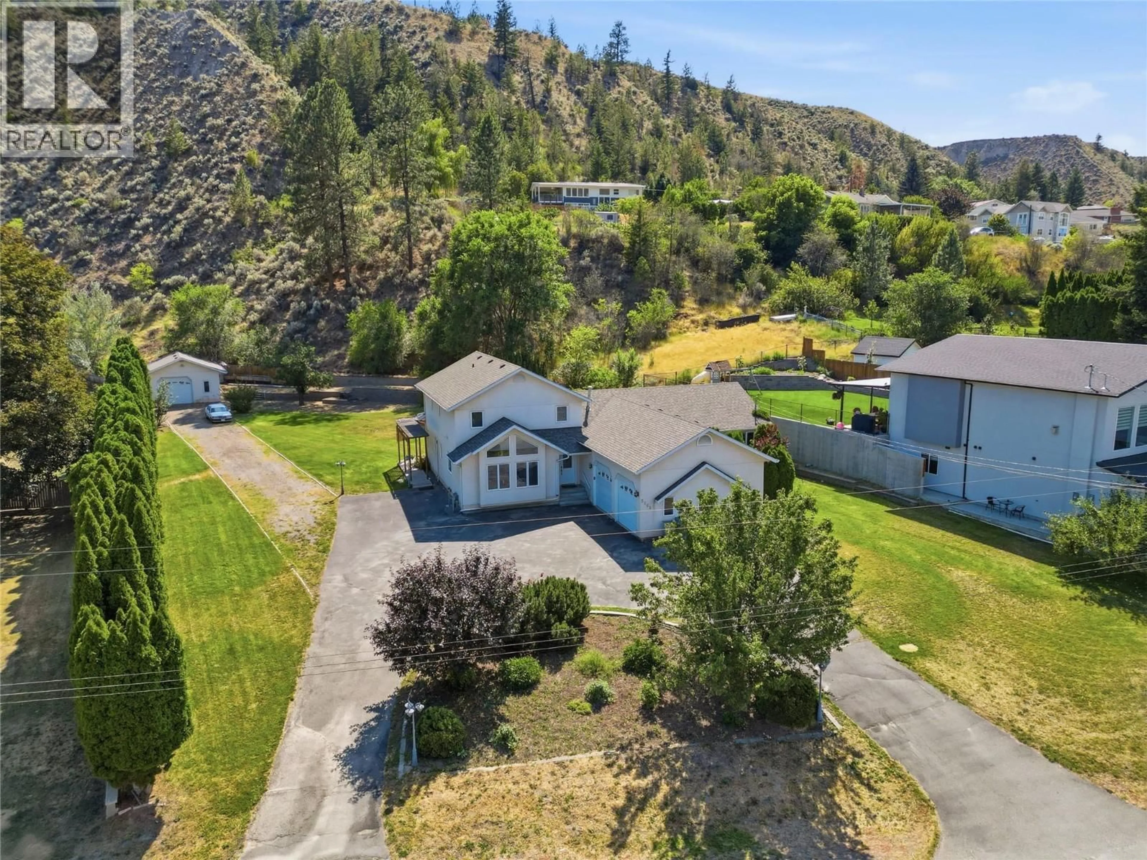 A pic from outside/outdoor area/front of a property/back of a property/a pic from drone, mountain view for 5565 DALLAS DRIVE, Kamloops British Columbia V2C4W9