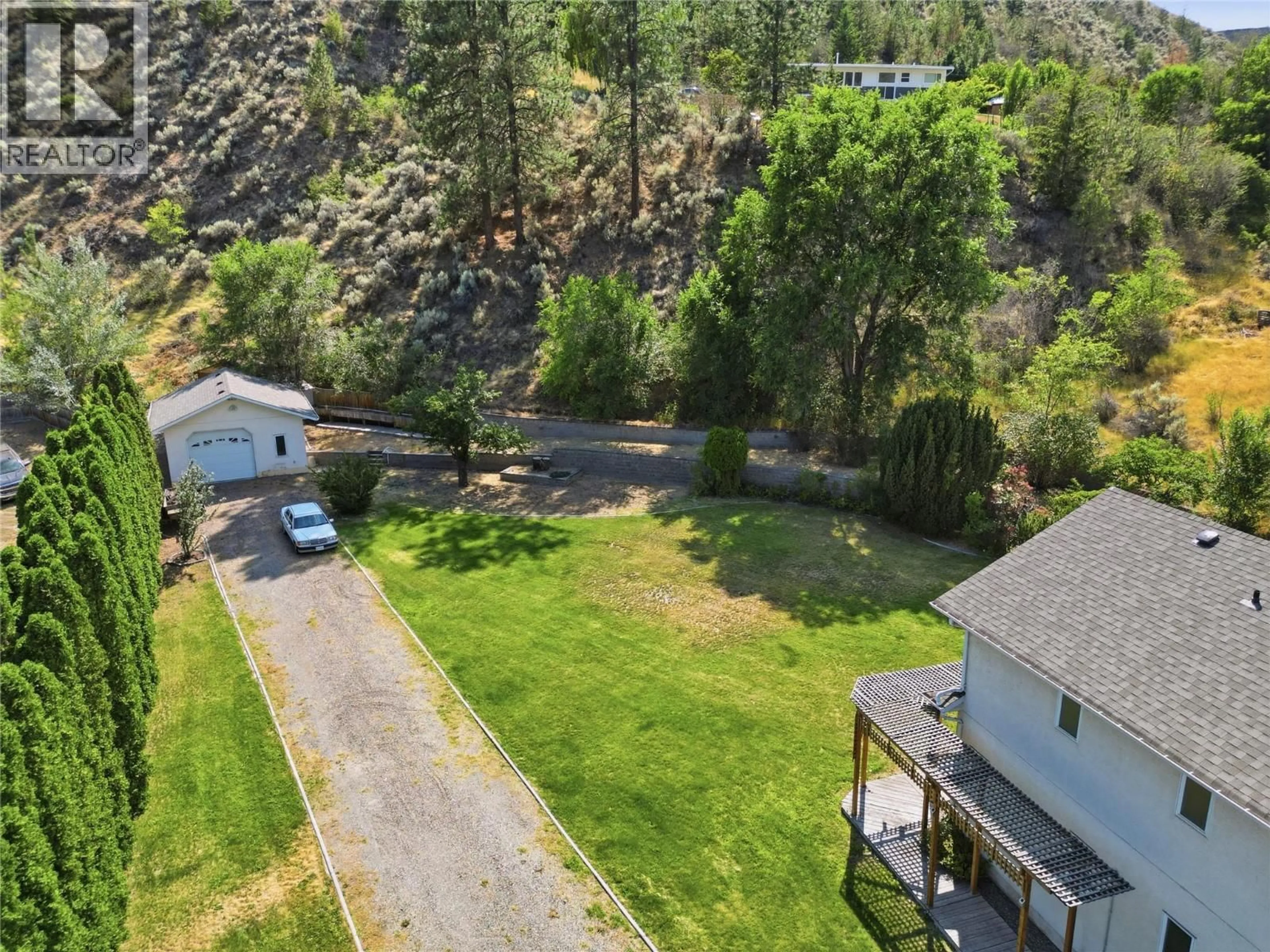 A pic from outside/outdoor area/front of a property/back of a property/a pic from drone, mountain view for 5565 DALLAS DRIVE, Kamloops British Columbia V2C4W9