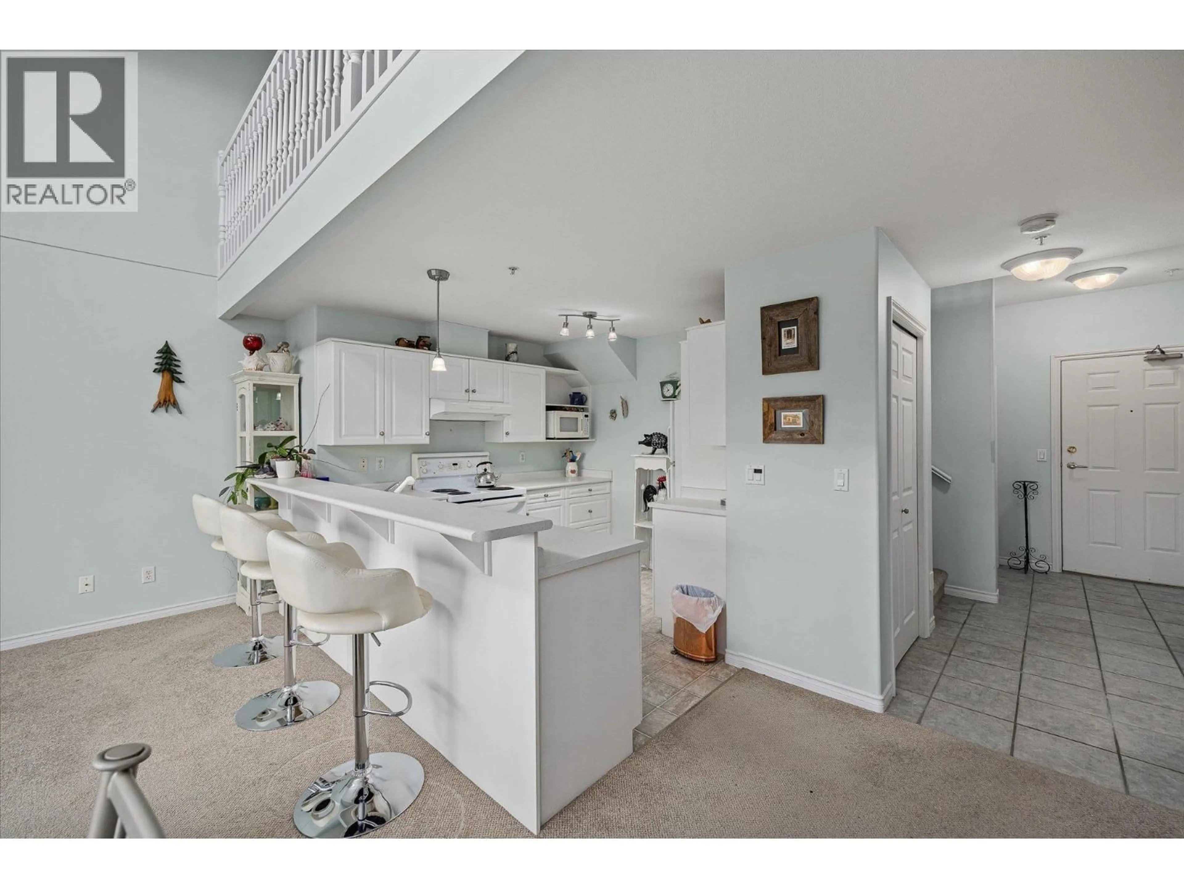 Open concept kitchen, ceramic/tile floor for 407 - 2388 BARON ROAD, Kelowna British Columbia V1X6X4