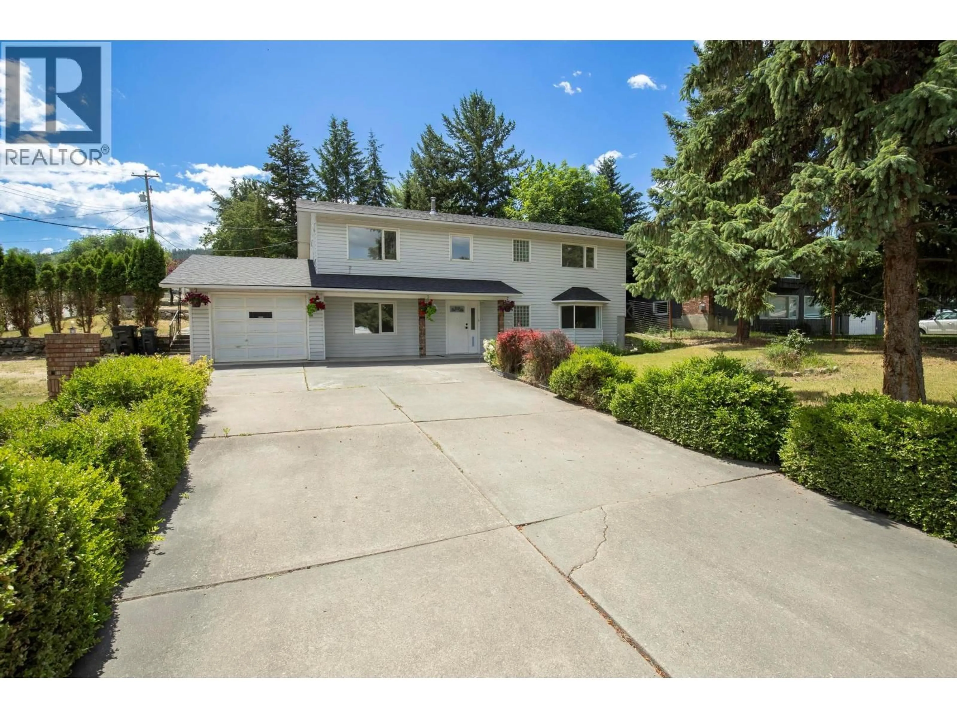 A pic from outside/outdoor area/front of a property/back of a property/a pic from drone, street for 7320 OKANAGAN LANDING ROAD, Vernon British Columbia V1H1G6