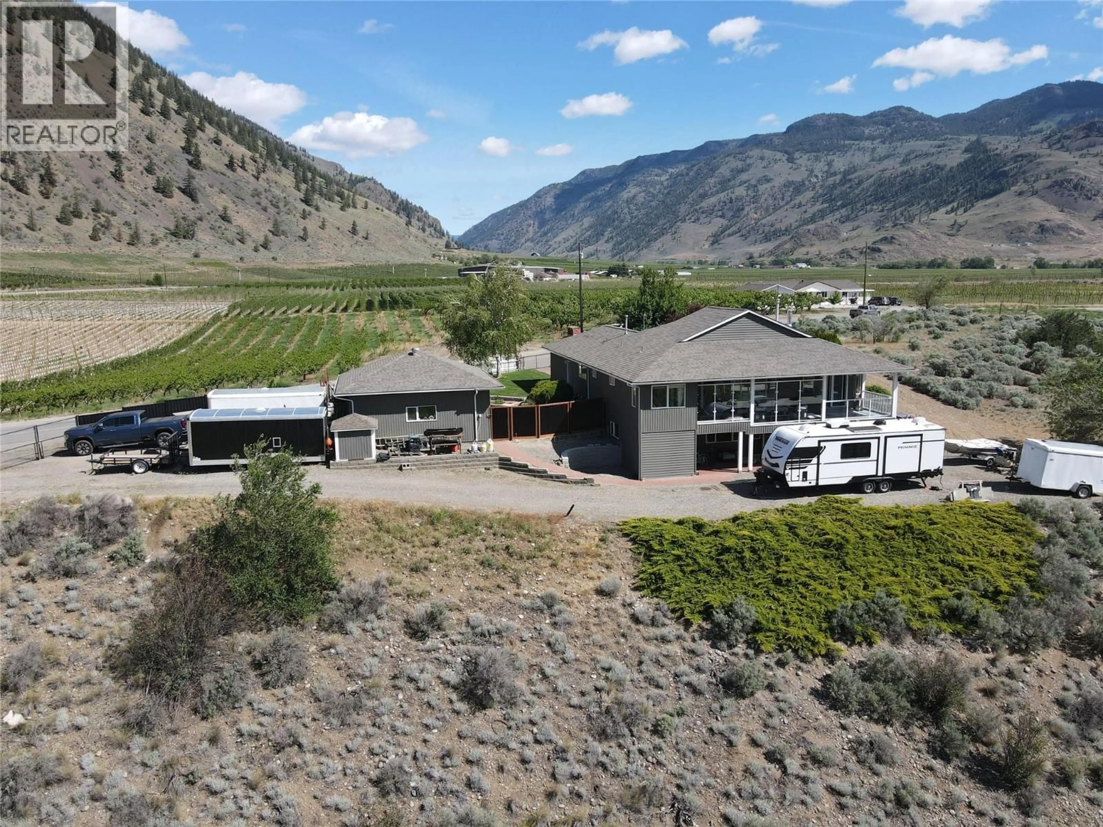 A pic from outside/outdoor area/front of a property/back of a property/a pic from drone, mountain view for 101 2ND AVENUE, Keremeos British Columbia V0X1N2