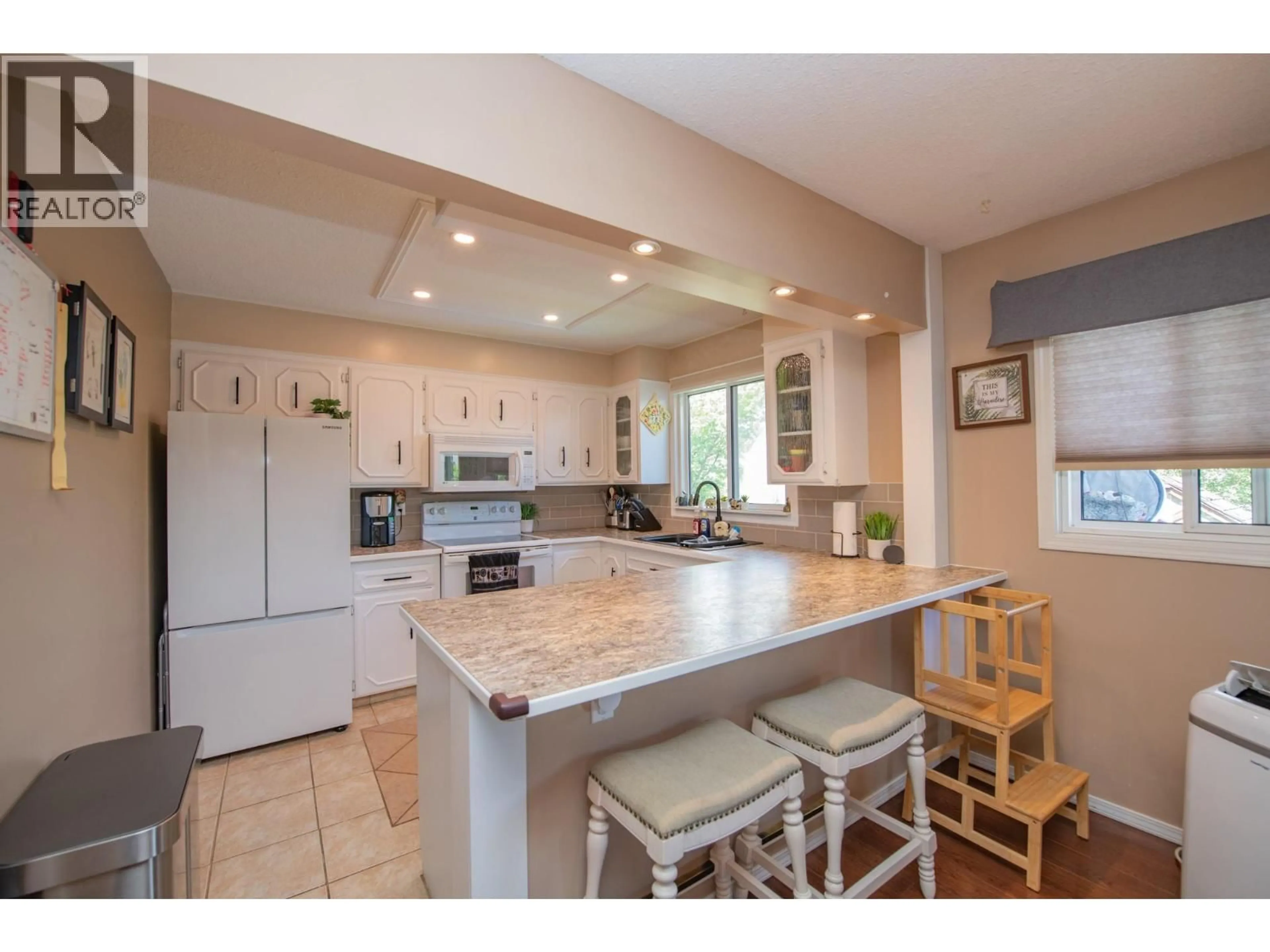 Open concept kitchen, ceramic/tile floor for 3701 15 AVENUE, Vernon British Columbia V1T7Z6