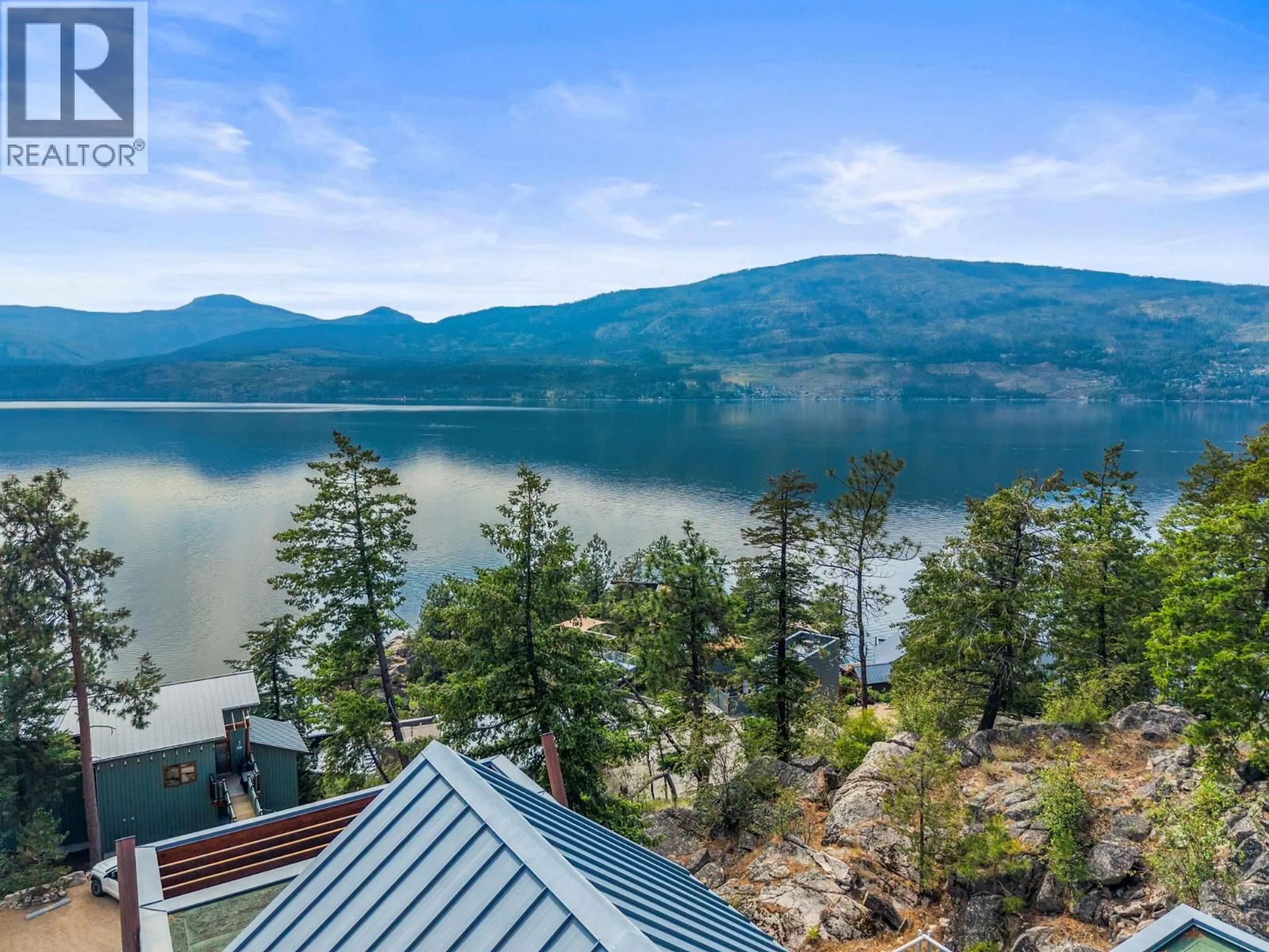 A pic from outside/outdoor area/front of a property/back of a property/a pic from drone, water/lake/river/ocean view for 158 - 9845 EASTSIDE ROAD, Vernon British Columbia V1H1Z2