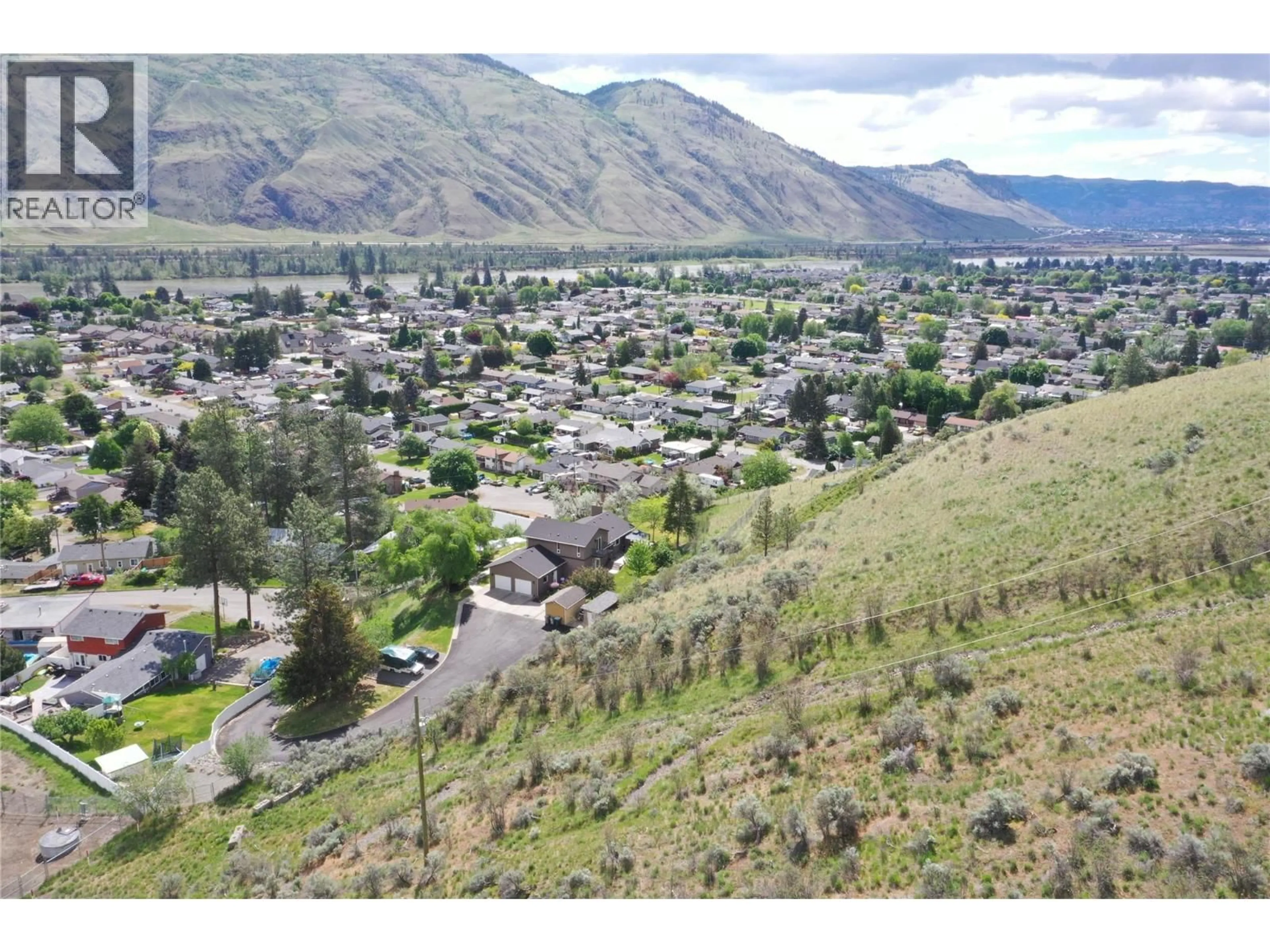 A pic from outside/outdoor area/front of a property/back of a property/a pic from drone, mountain view for 3084 DOHM ROAD, Kamloops British Columbia V2B7L8