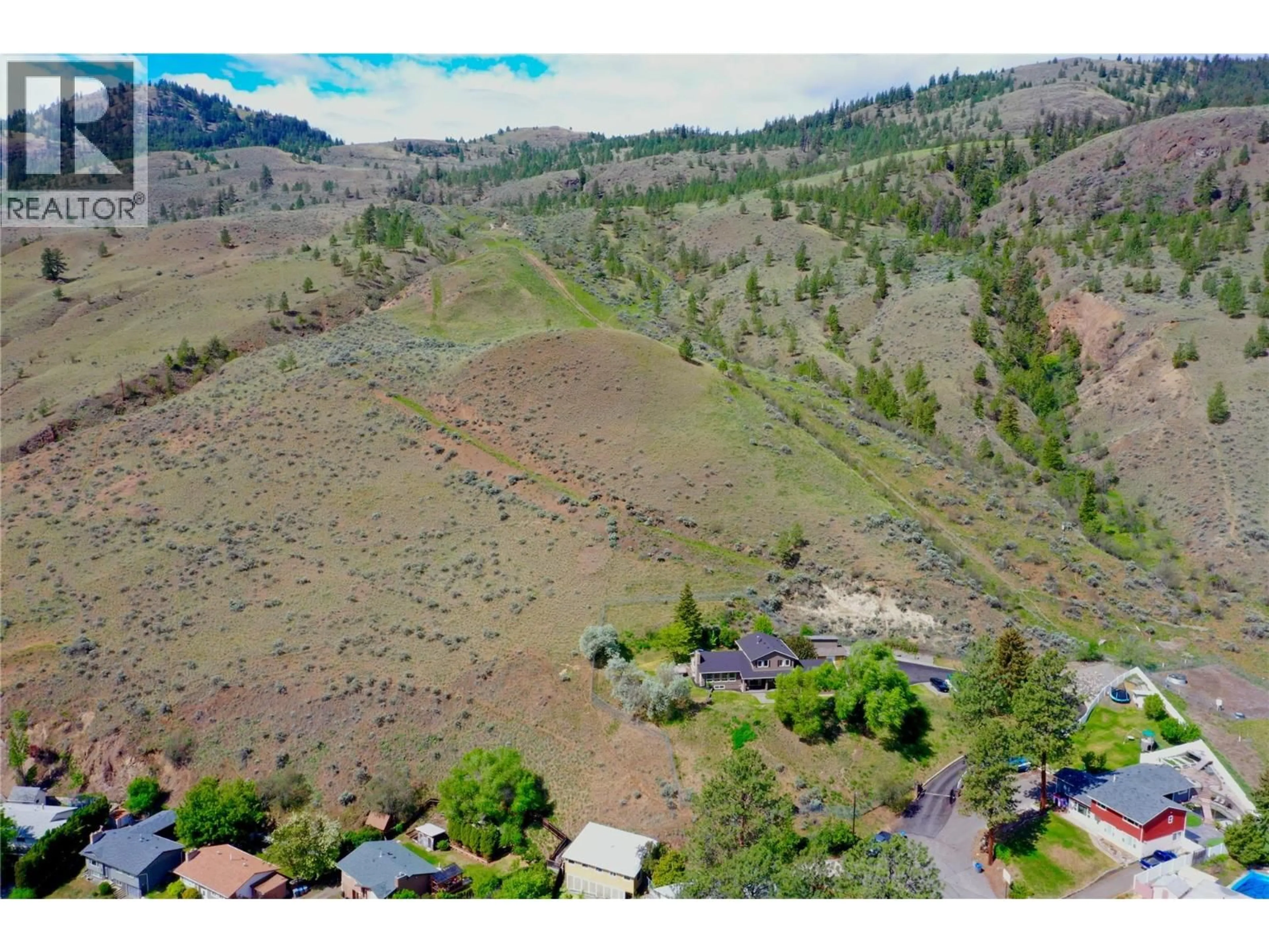 A pic from outside/outdoor area/front of a property/back of a property/a pic from drone, mountain view for 3084 DOHM ROAD, Kamloops British Columbia V2B7L8