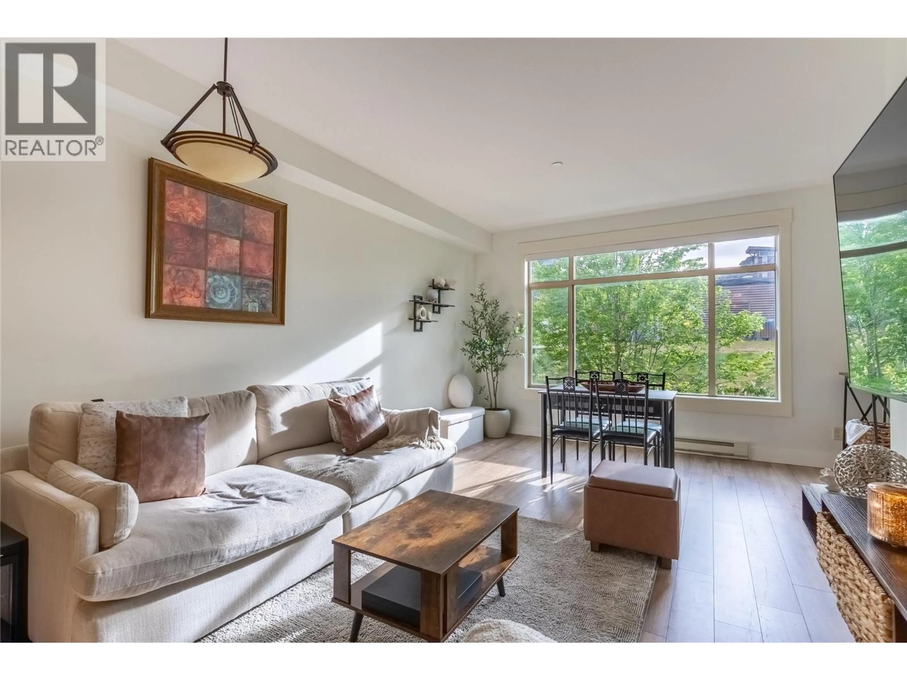 Living room with furniture, wood/laminate floor for 304 - 795 MCGILL ROAD, Kamloops British Columbia V2C0B9