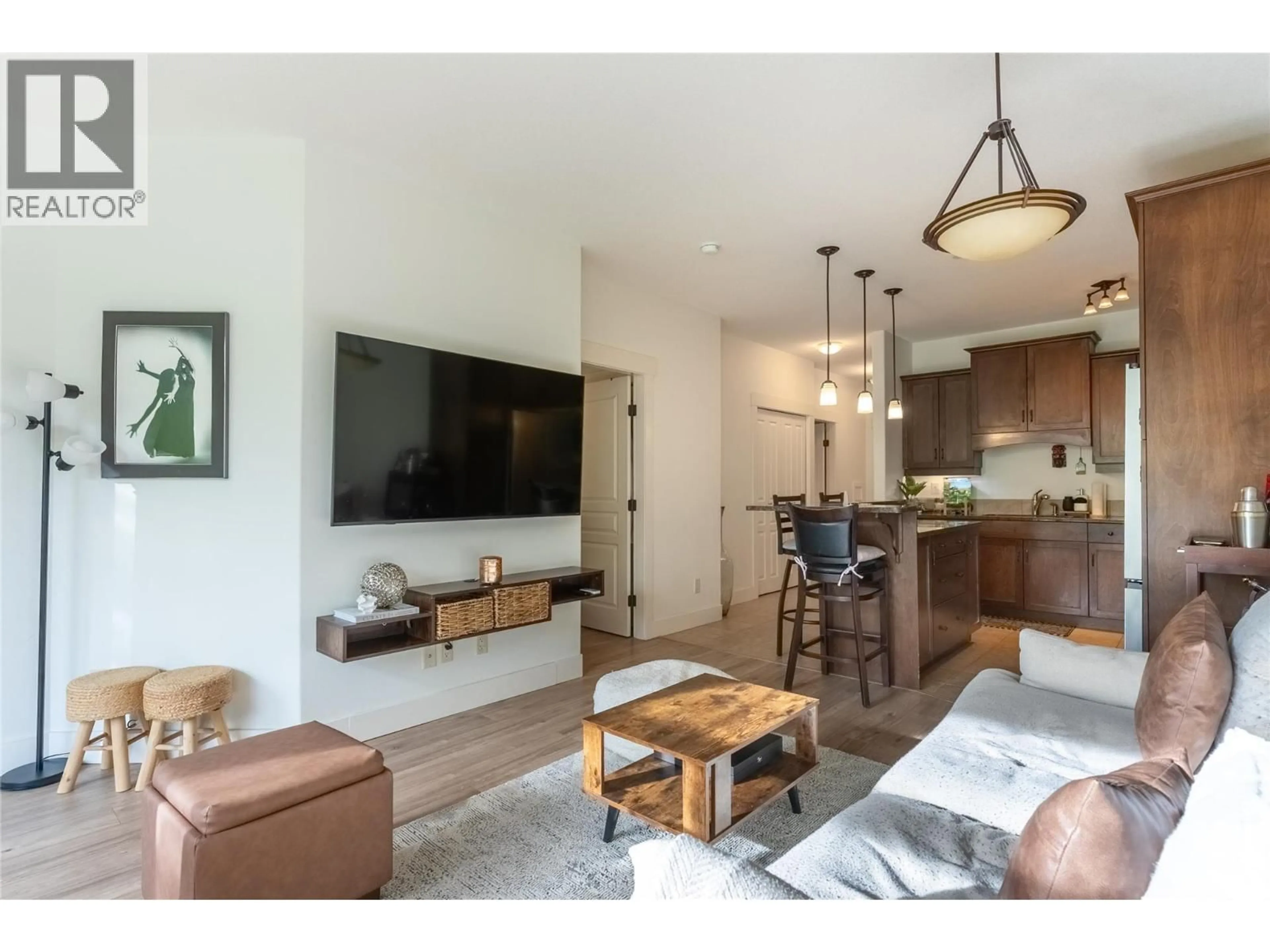 Living room with furniture, wood/laminate floor for 304 - 795 MCGILL ROAD, Kamloops British Columbia V2C0B9