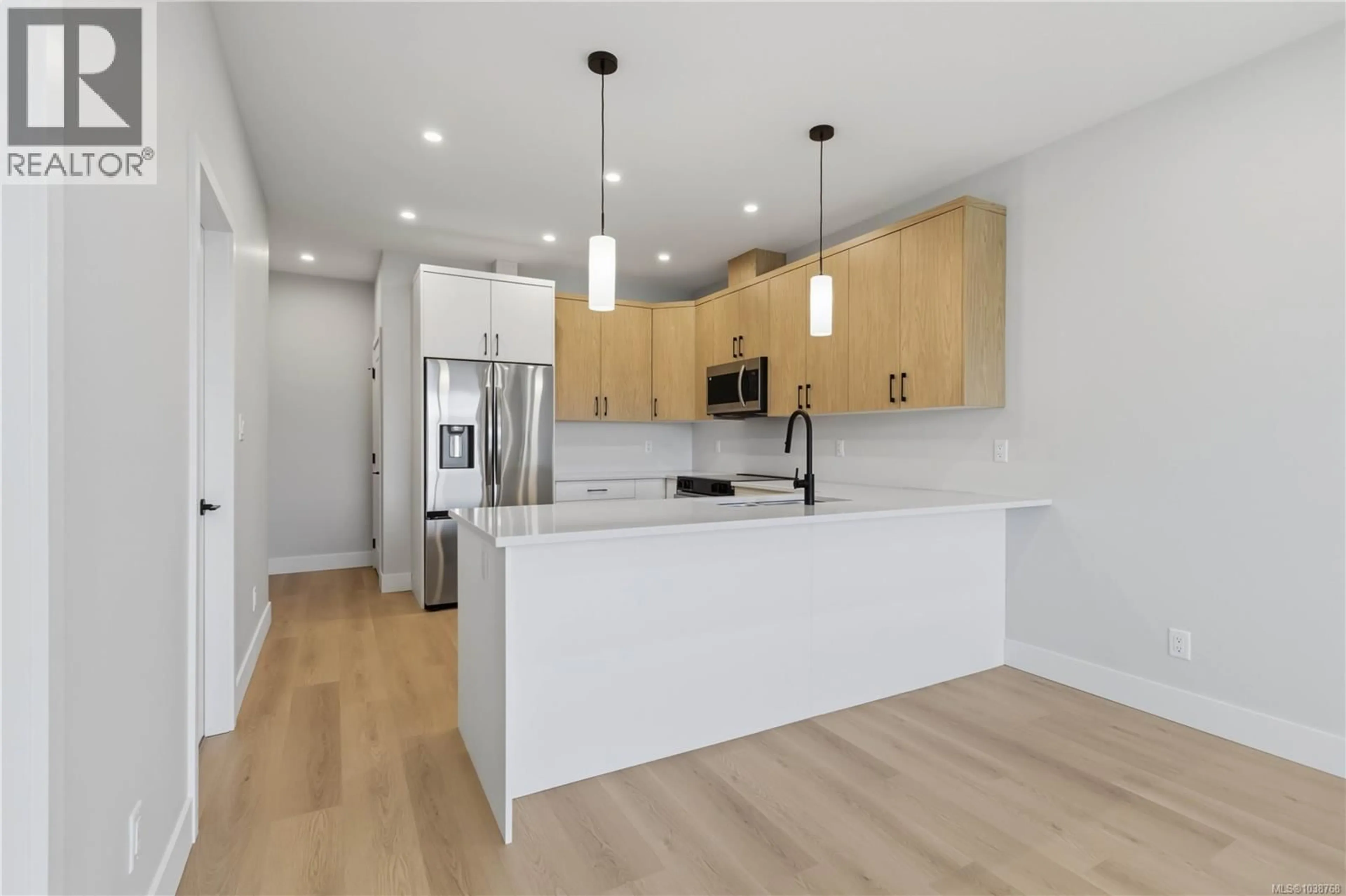 Open concept kitchen, wood/laminate floor for 3482 MERLOT TERRACE, Langford British Columbia V9C0W1