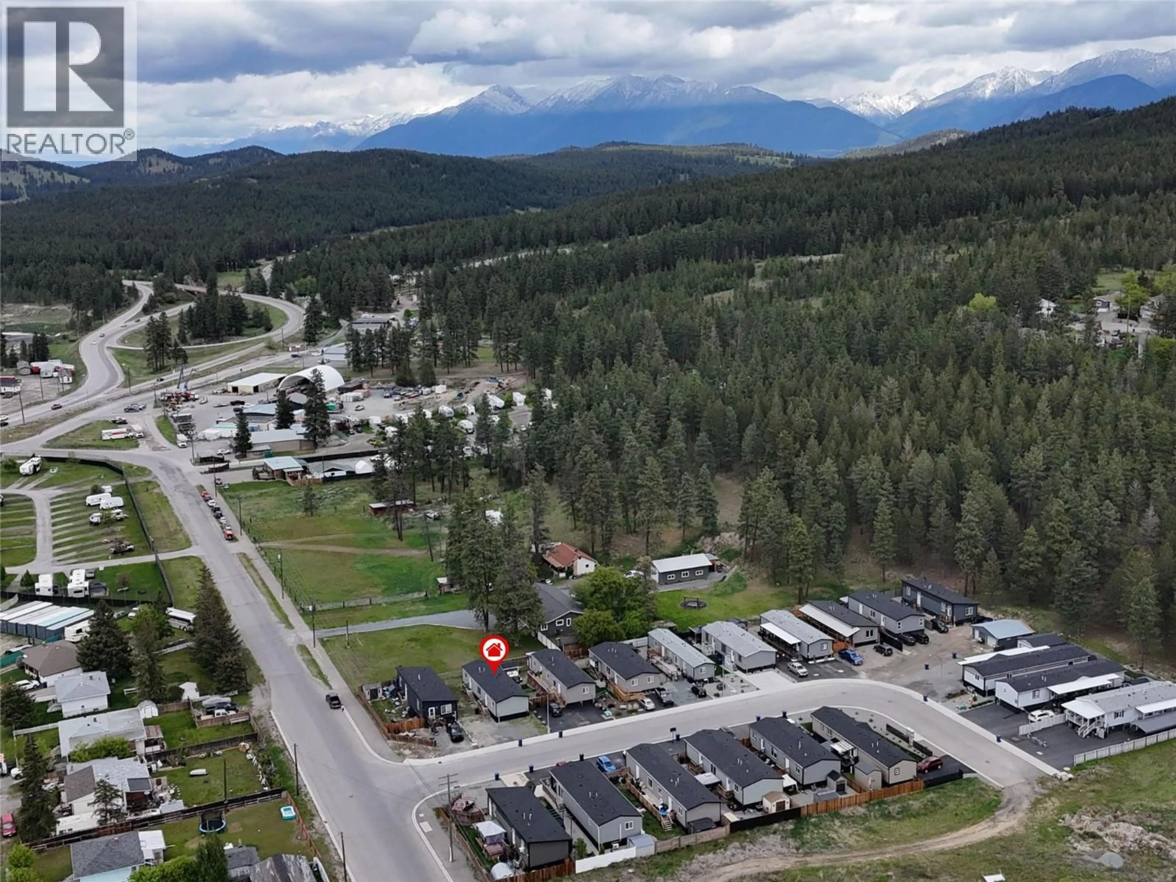 A pic from outside/outdoor area/front of a property/back of a property/a pic from drone, mountain view for 3066 PINNACLE CRESCENT NORTH, Cranbrook British Columbia V1C0E5