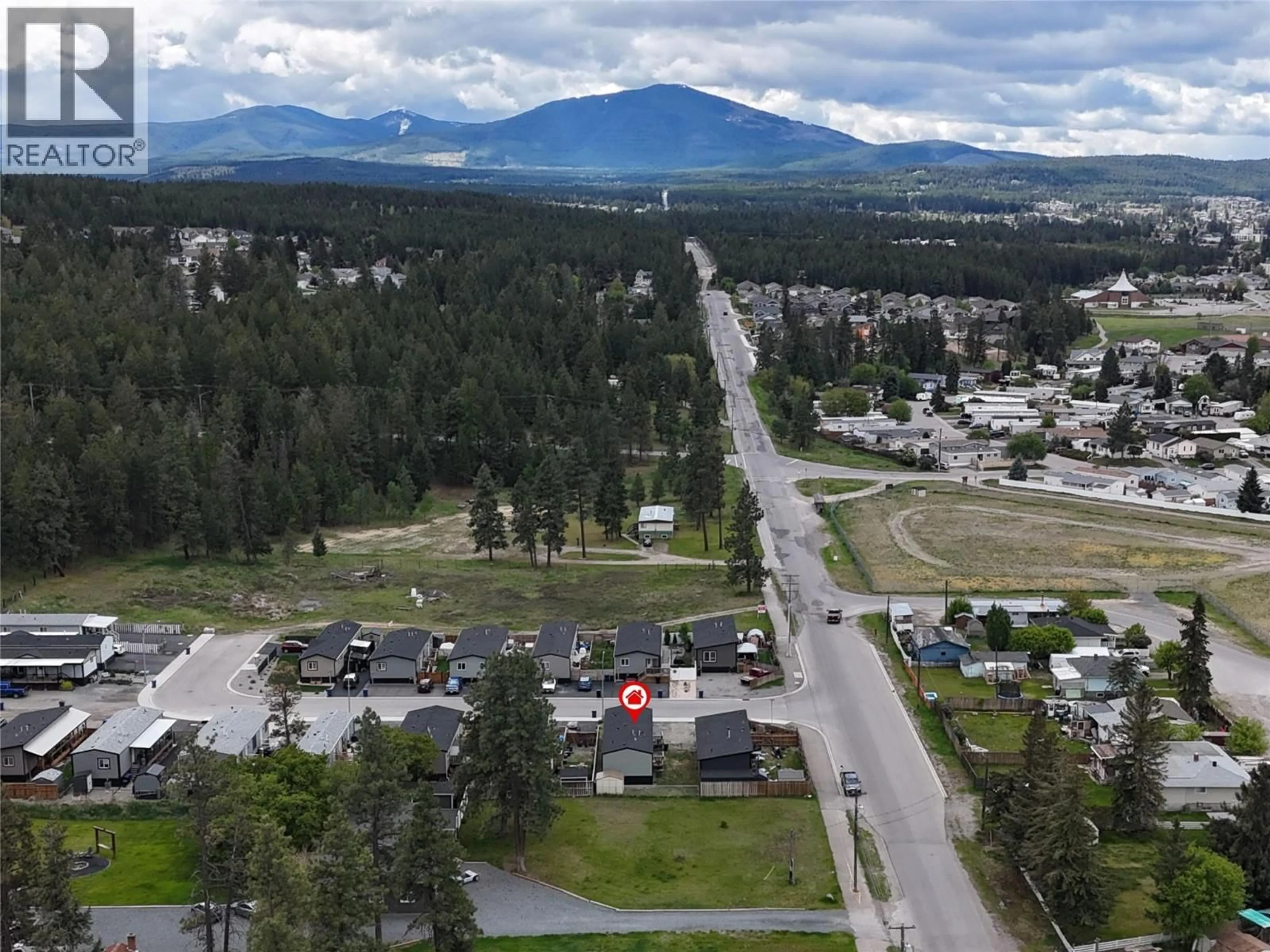 A pic from outside/outdoor area/front of a property/back of a property/a pic from drone, mountain view for 3066 PINNACLE CRESCENT NORTH, Cranbrook British Columbia V1C0E5