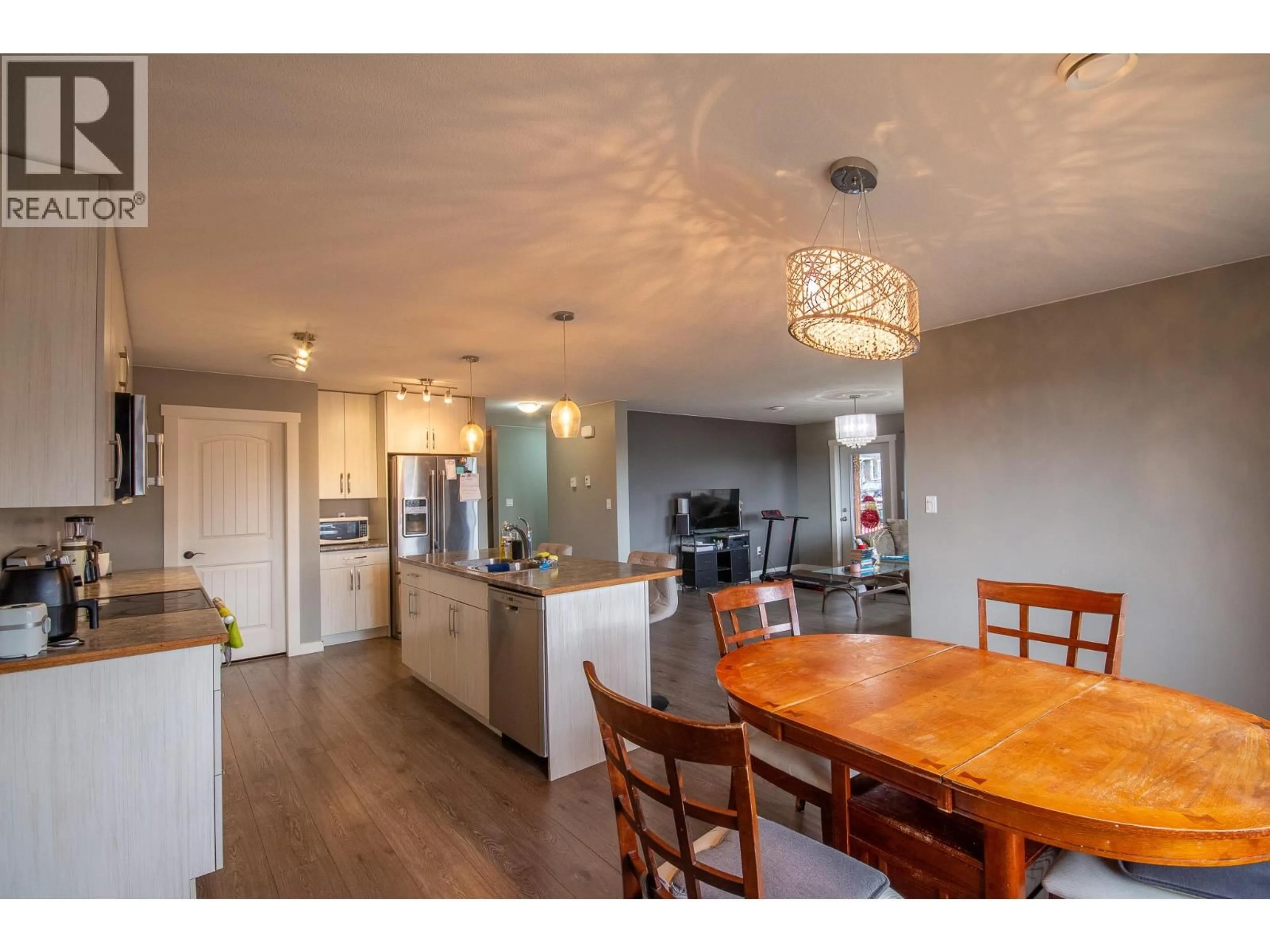 Open concept kitchen, wood/laminate floor for 8217 18 STREET, Dawson Creek British Columbia V1G0G4