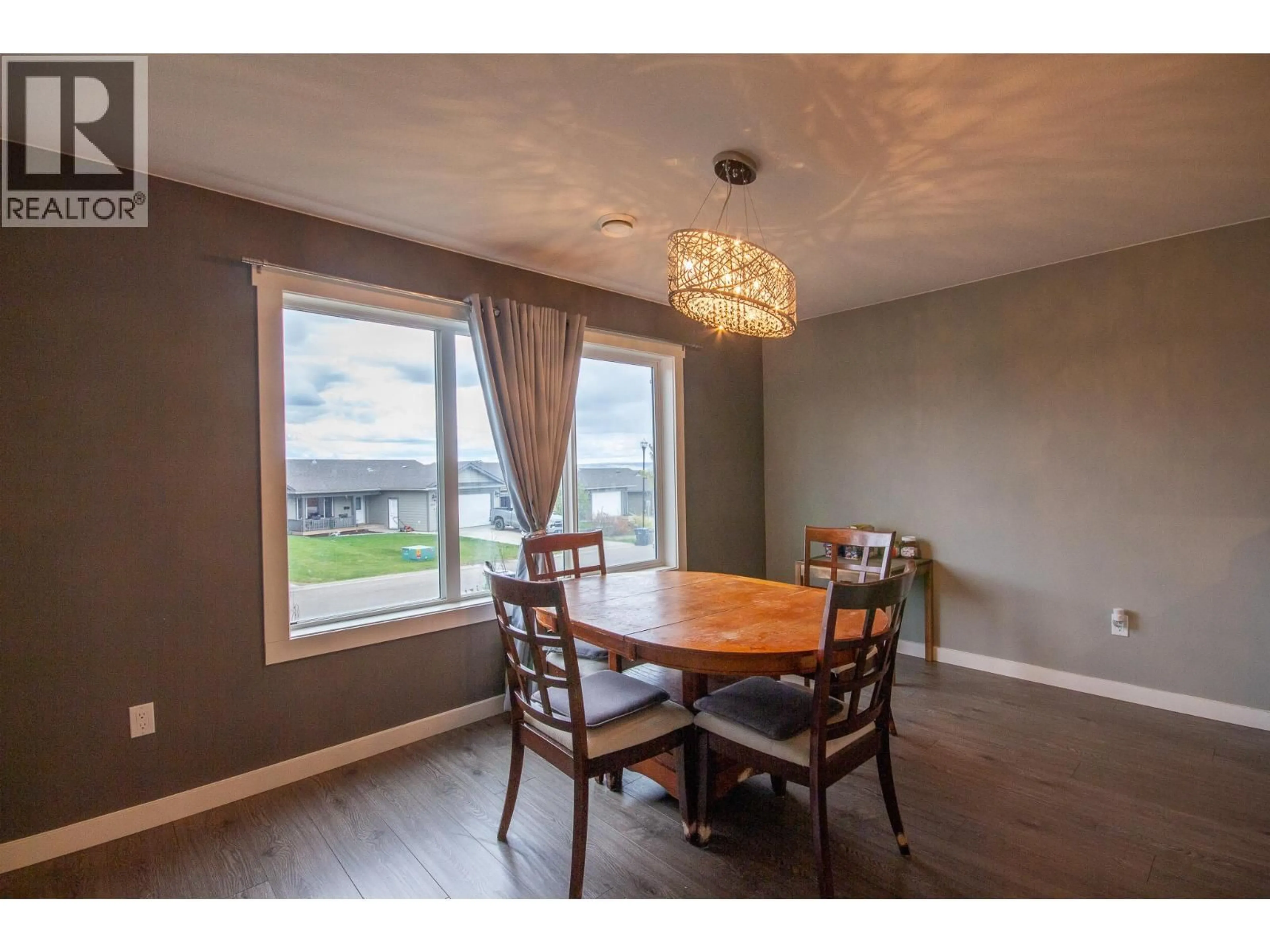 Dining room, wood/laminate floor for 8217 18 STREET, Dawson Creek British Columbia V1G0G4