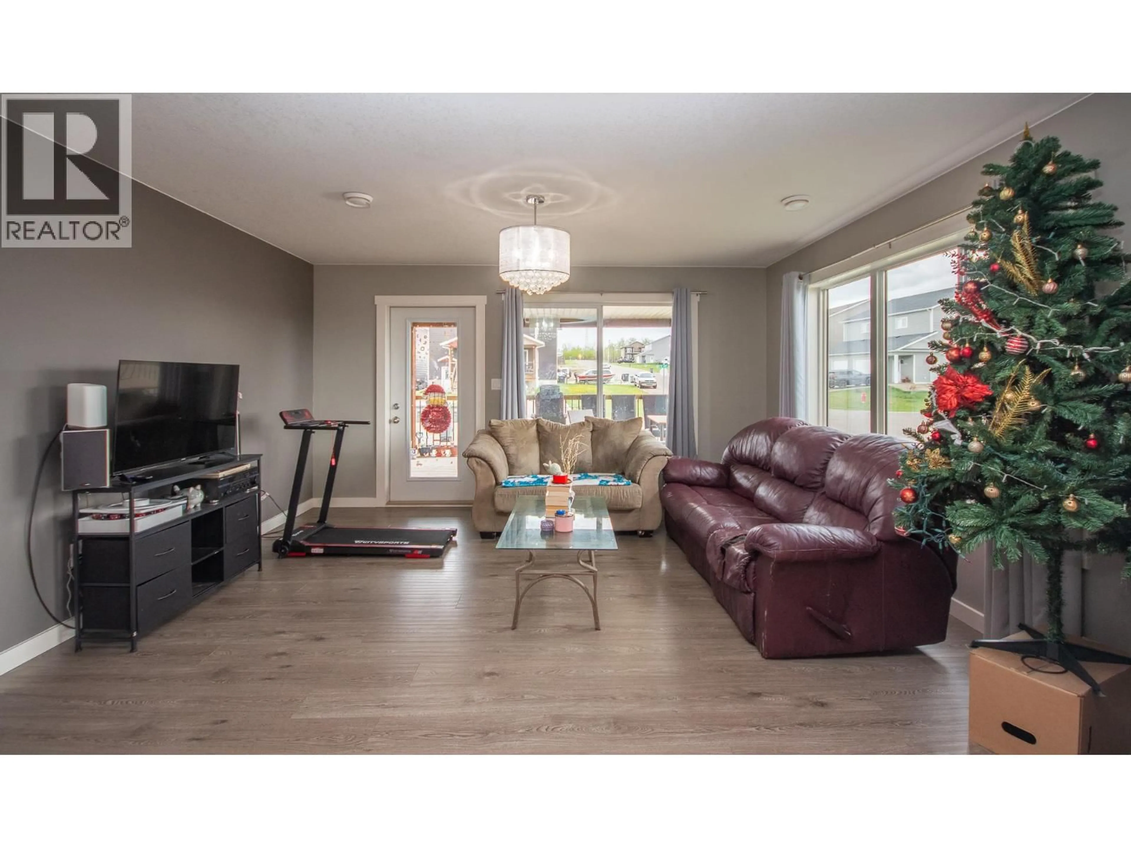 Living room with furniture, wood/laminate floor for 8217 18 STREET, Dawson Creek British Columbia V1G0G4
