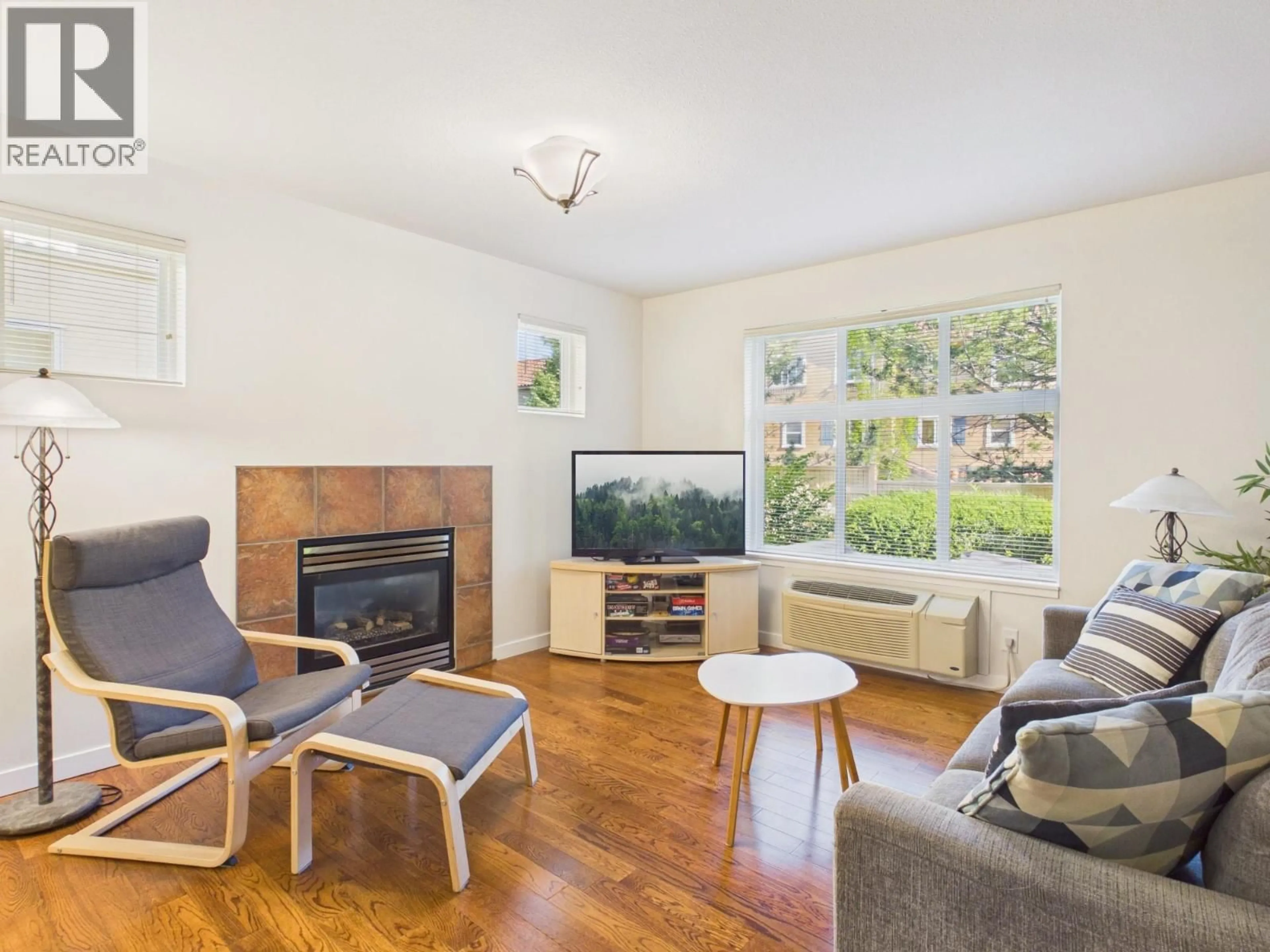 Living room with furniture, wood/laminate floor for 6 - 7600 COTTONWOOD DRIVE, Osoyoos British Columbia V0H1V3