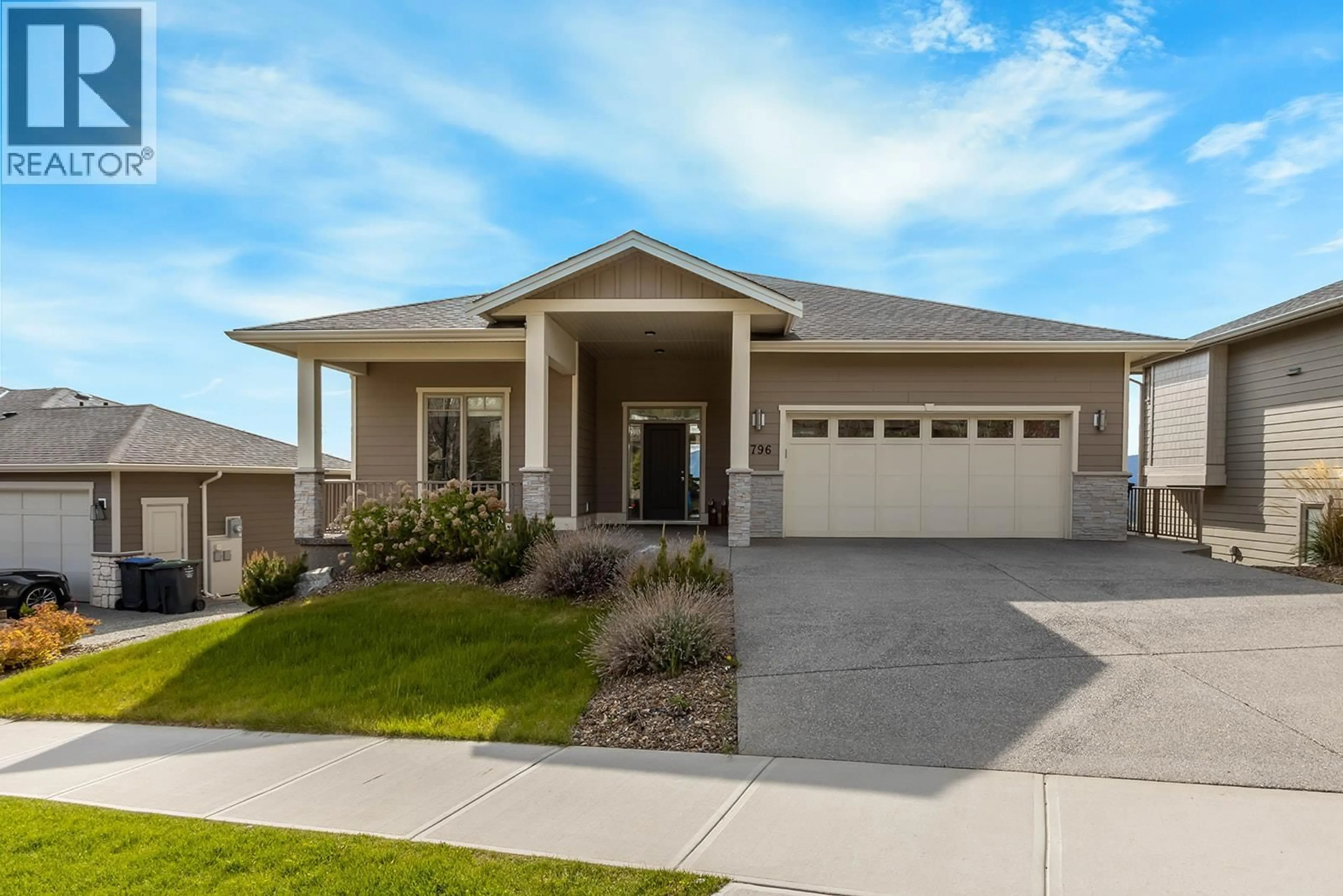Home with vinyl exterior material, street for 1796 TOWER RANCH BOULEVARD, Kelowna British Columbia V1P1B5