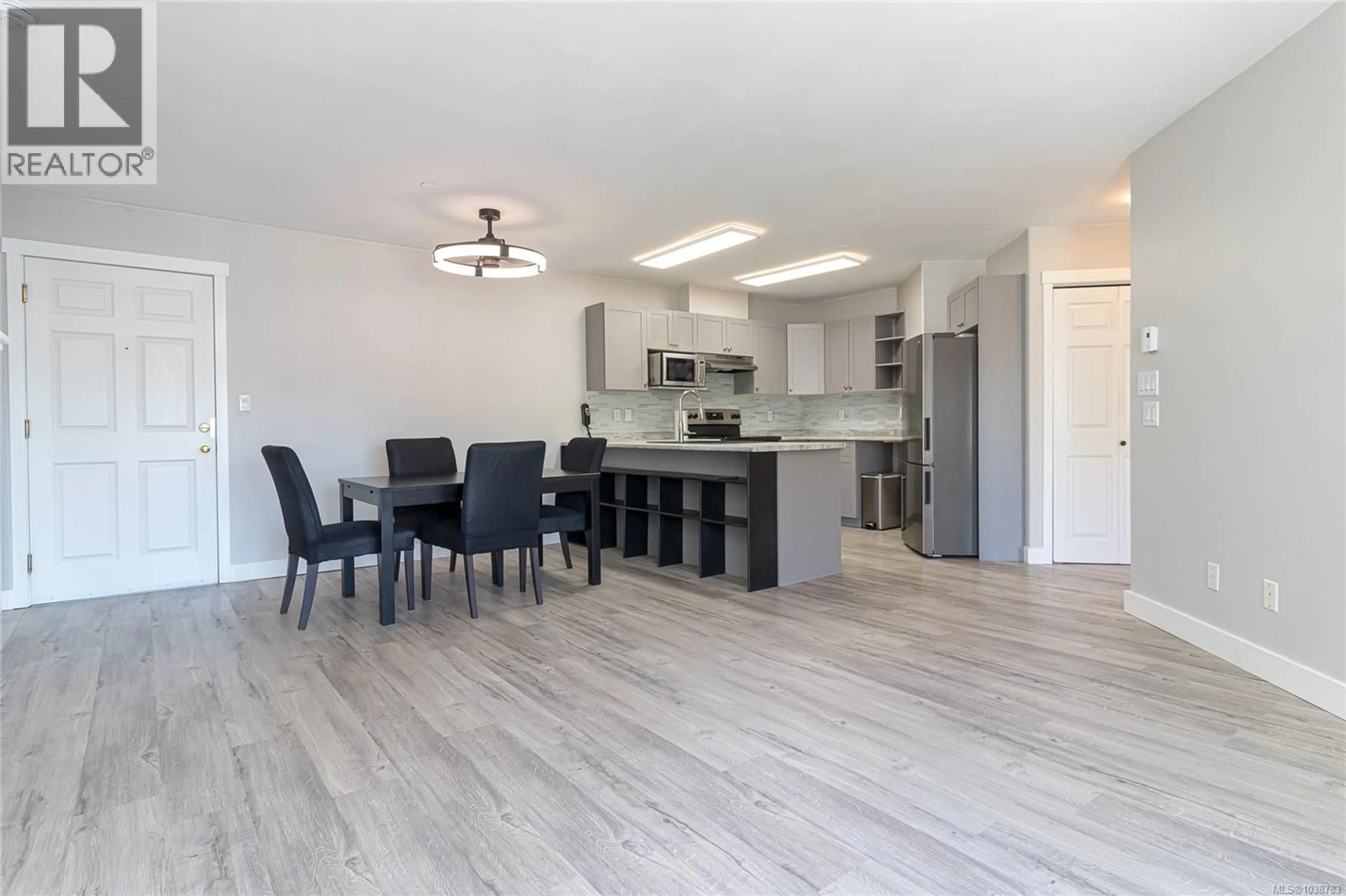 Open concept kitchen, wood/laminate floor for 401 - 893 HOCKLEY AVENUE, Langford British Columbia V9B2V8