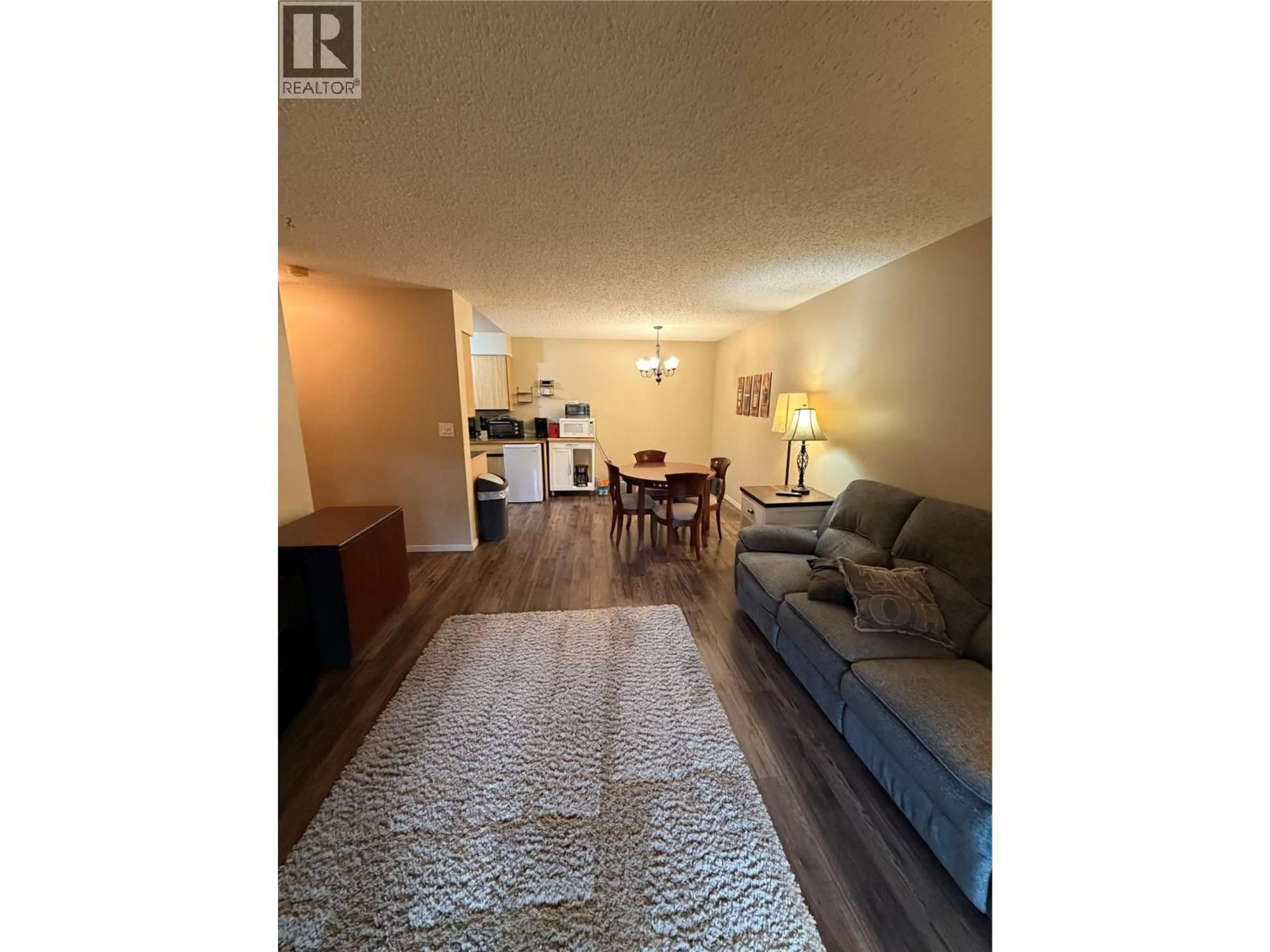 Living room with furniture, wood/laminate floor for 302 - 775 BALMER CRESCENT, Elkford British Columbia V0B1H0