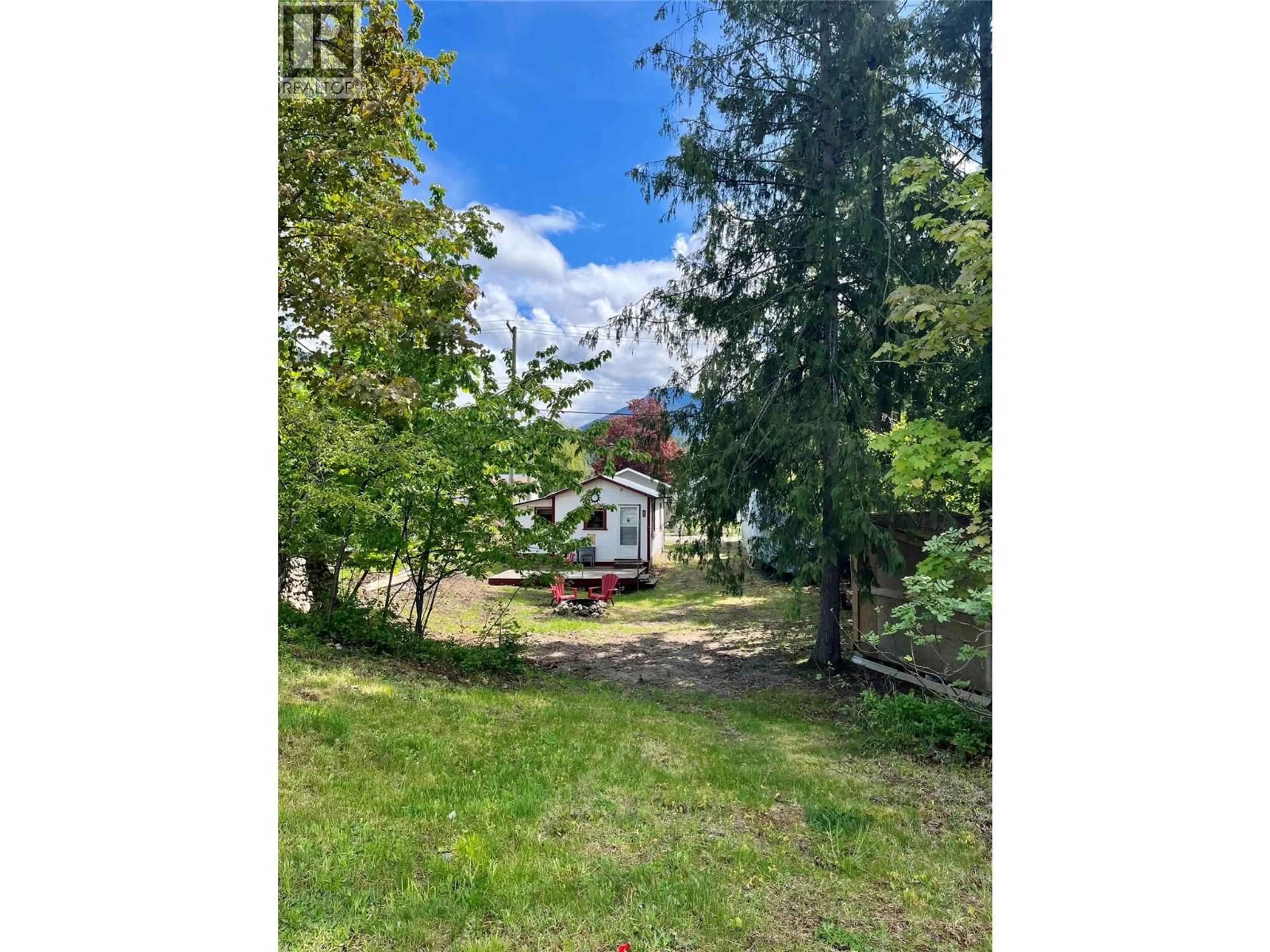 A pic from outside/outdoor area/front of a property/back of a property/a pic from drone, forest/trees view for 305 8TH AVENUE NORTHWEST, Nakusp British Columbia V0G1R0