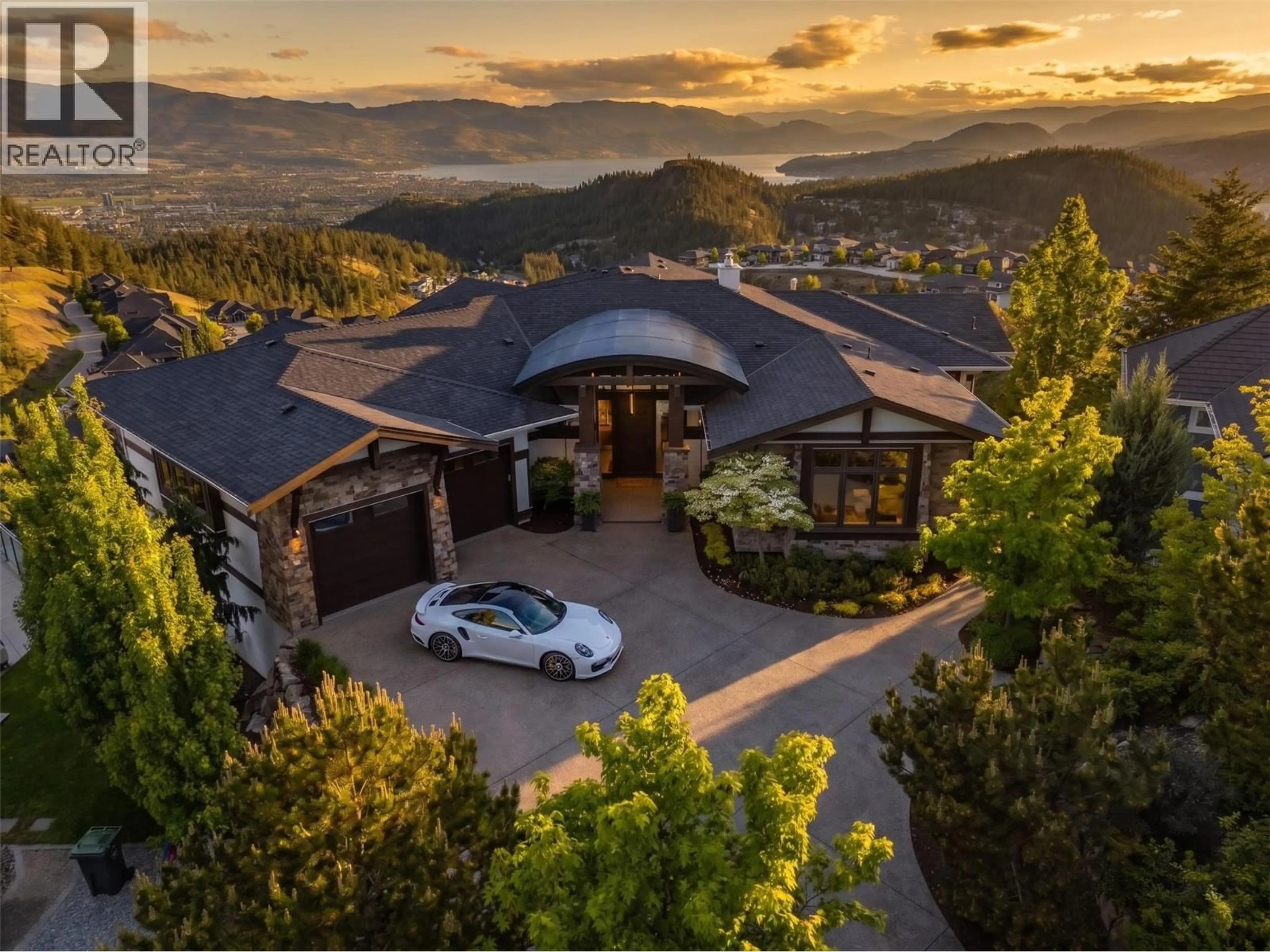 A pic from outside/outdoor area/front of a property/back of a property/a pic from drone, mountain view for 162 SKYLAND DRIVE, Kelowna British Columbia V1V3A1