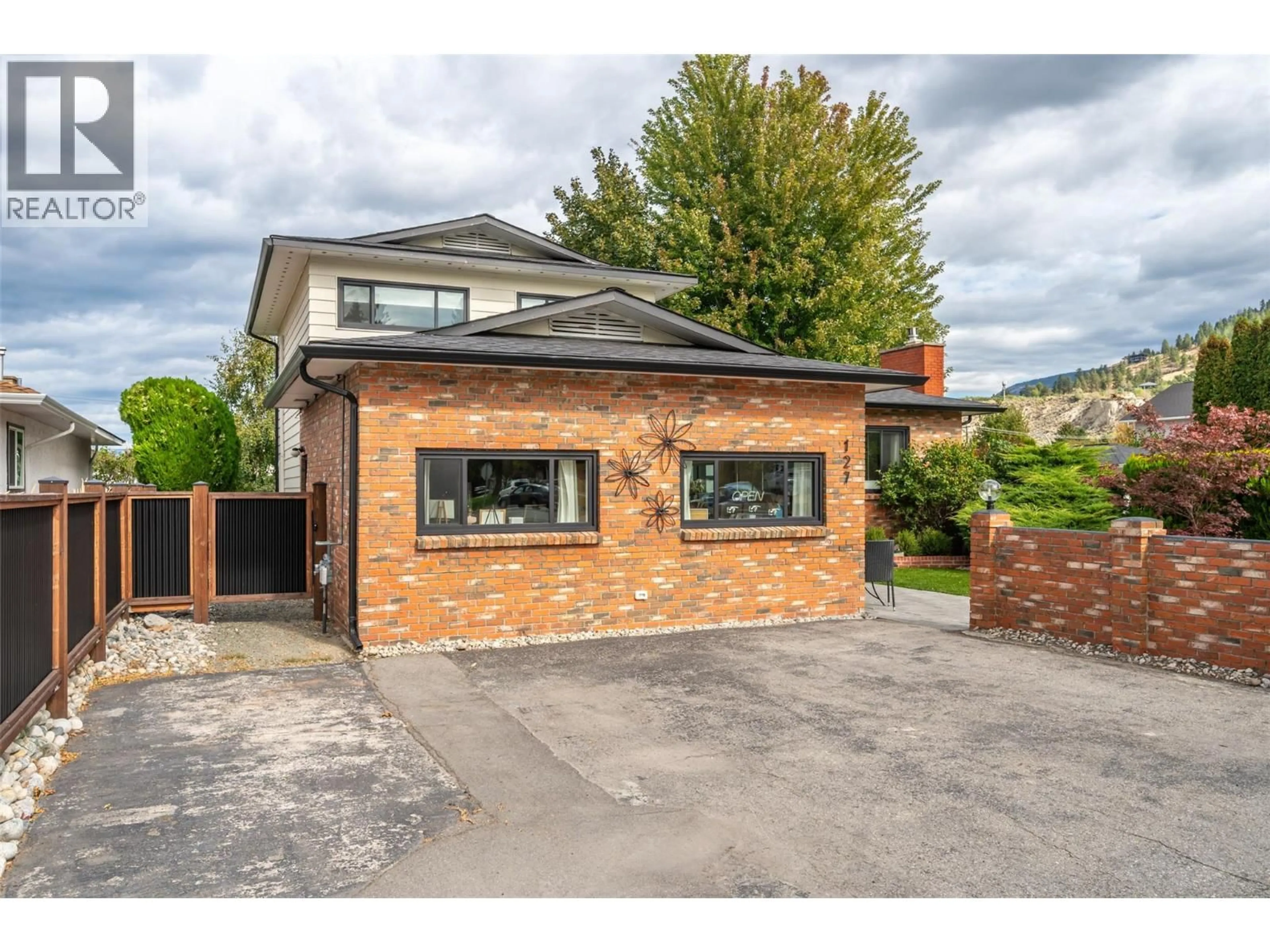 Home with brick exterior material, street for 127 ELM AVENUE, Penticton British Columbia V2A3W1