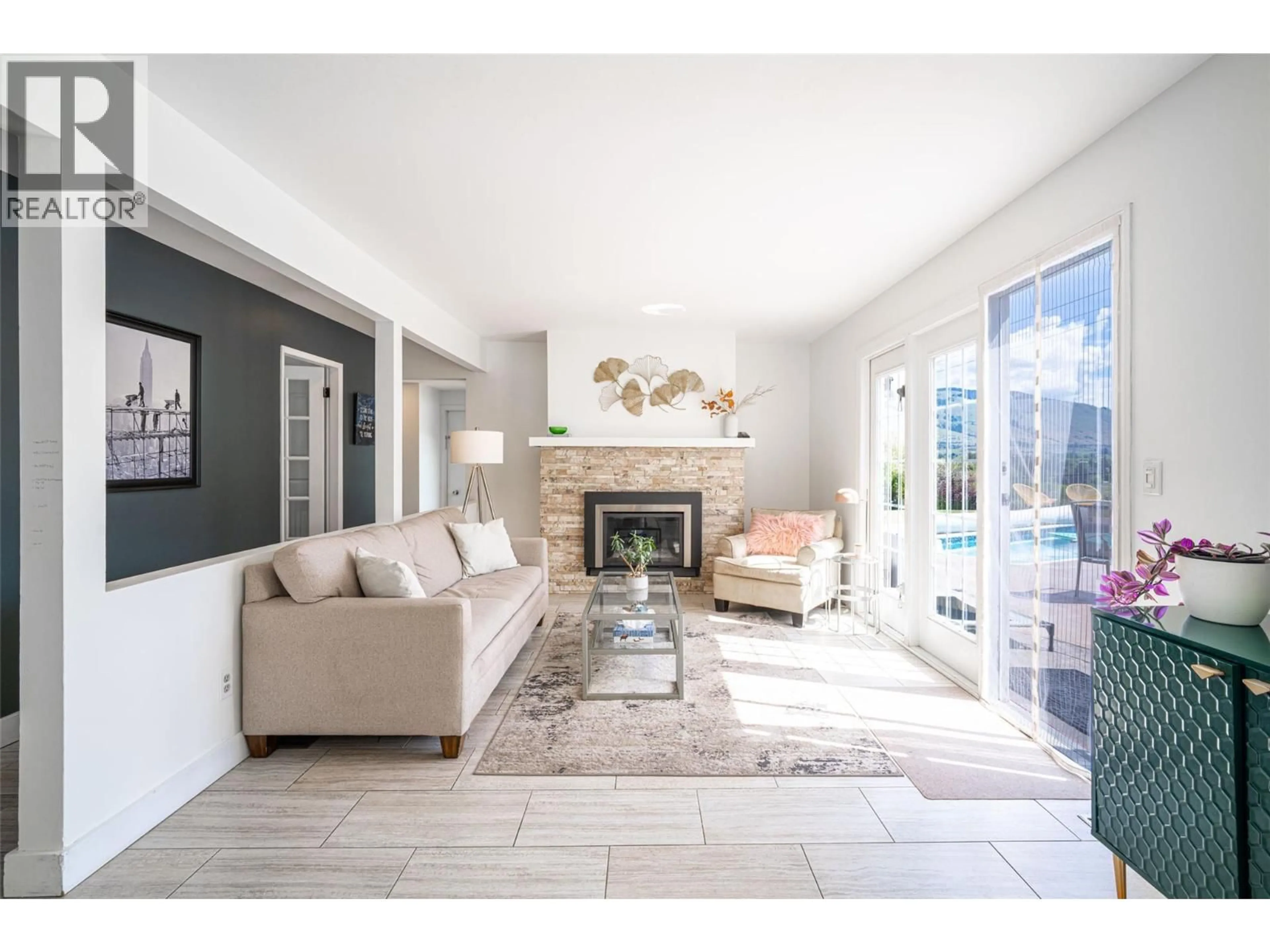 Living room with furniture, ceramic/tile floor for 11306 HILLSIDE DRIVE, Coldstream British Columbia V1B1Z8
