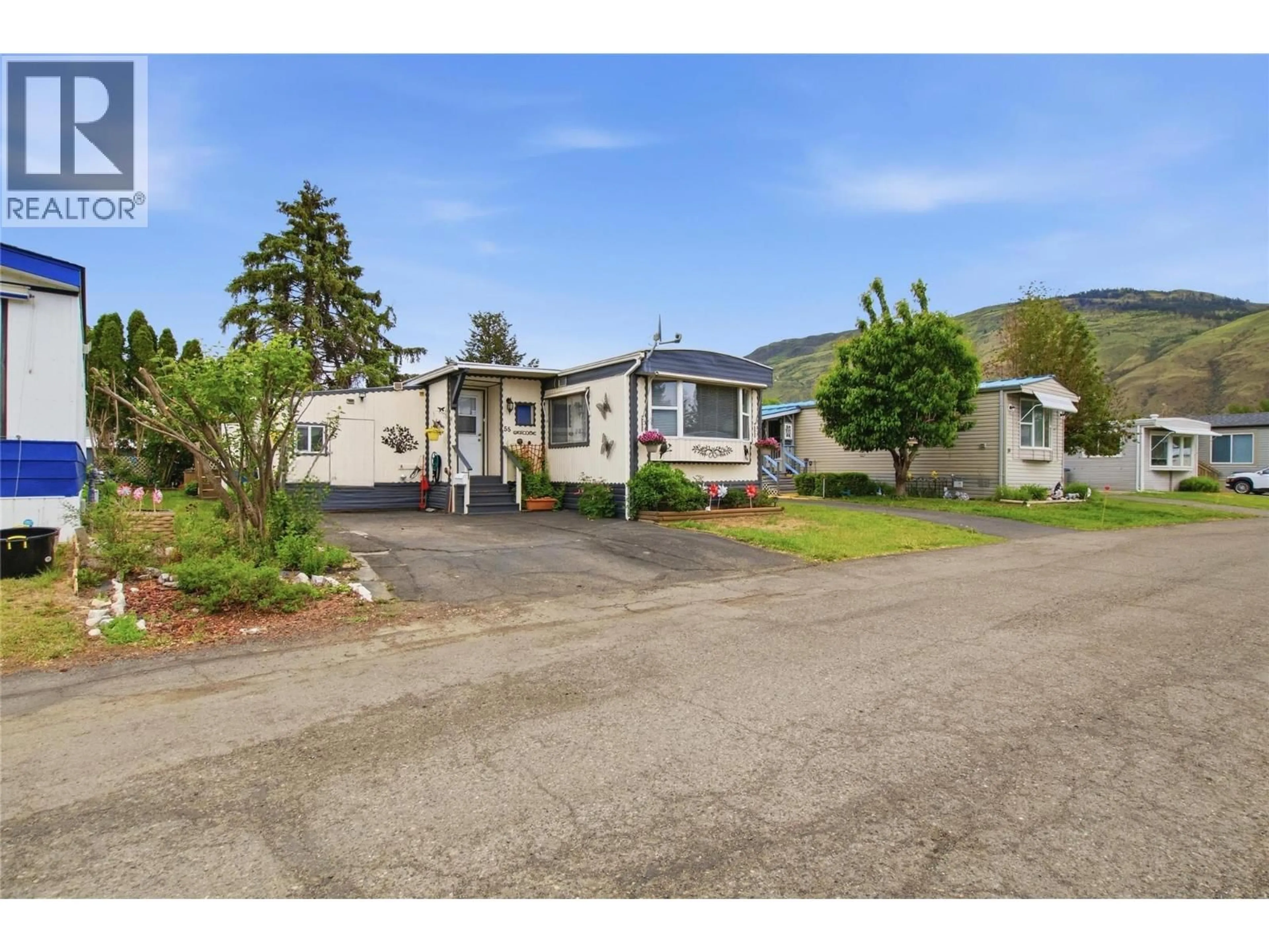 A pic from outside/outdoor area/front of a property/back of a property/a pic from drone, street for 55 - 2400 OAKDALE WAY, Kamloops British Columbia V2B6W7