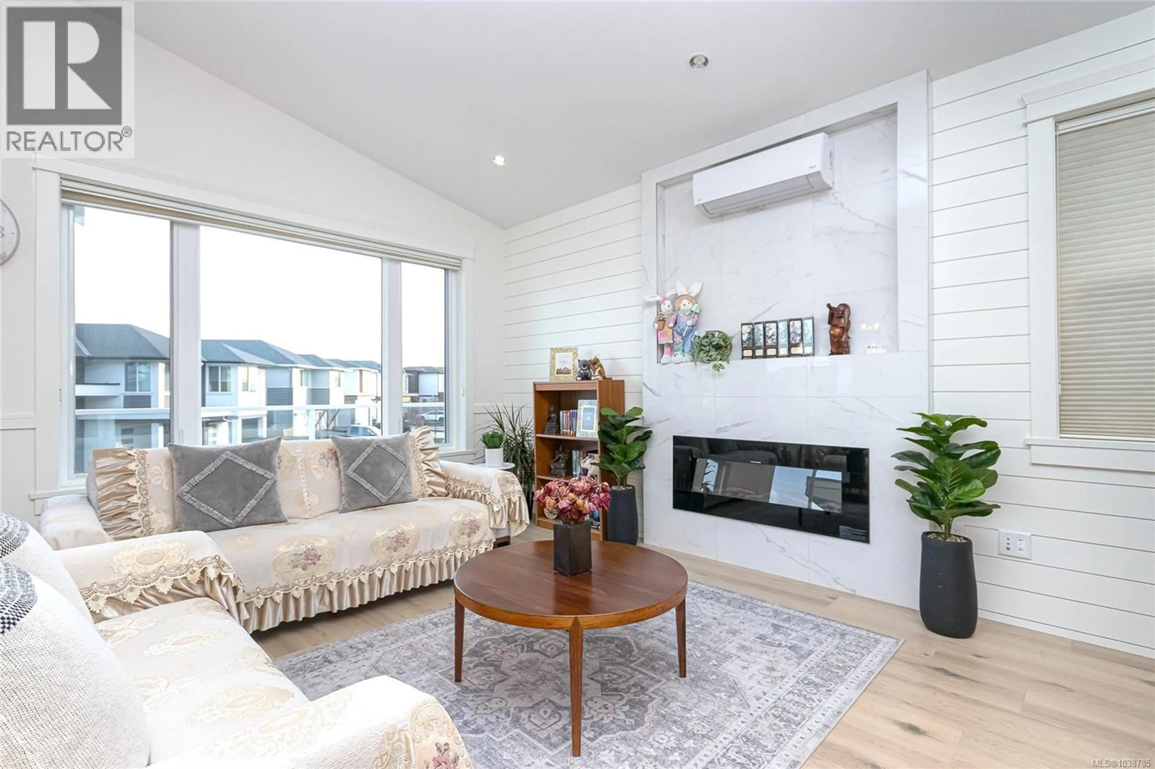 Living room with furniture, wood/laminate floor for 2406 AZURITE CRESCENT, Langford British Columbia V9B0Z6