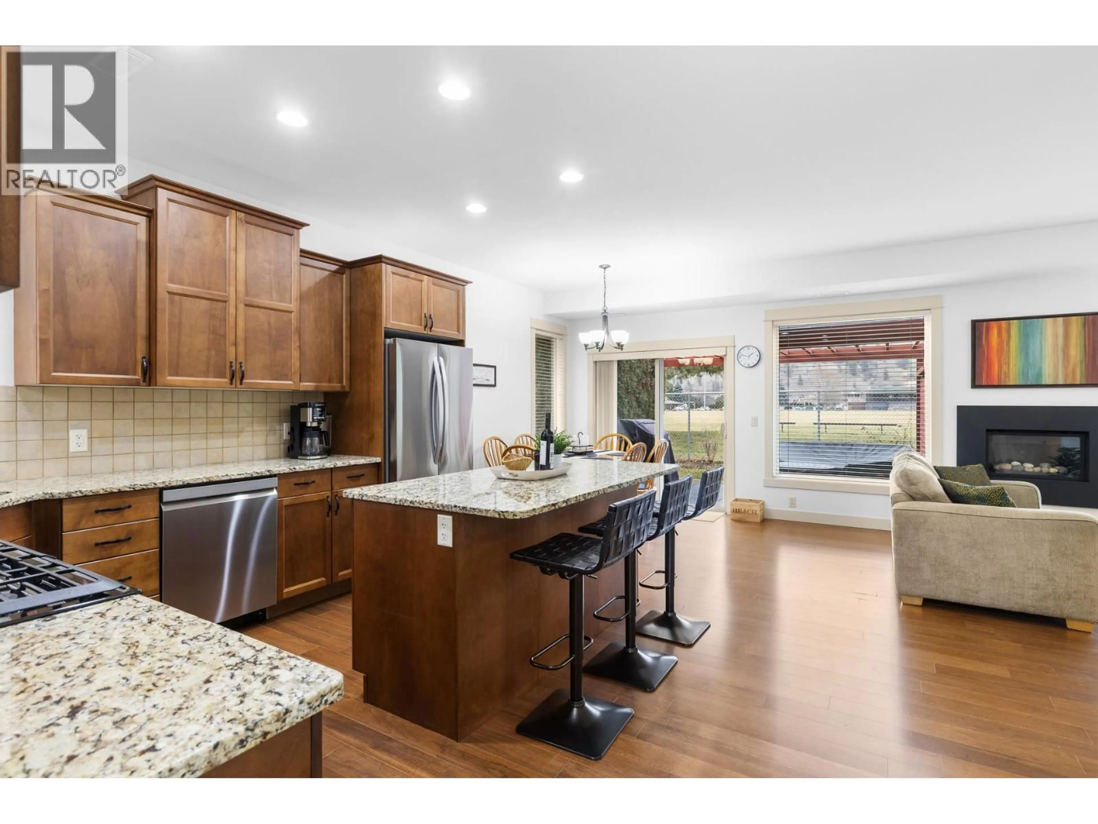 Open concept kitchen, wood/laminate floor for 504 - 3350 WOODSDALE ROAD, Lake Country British Columbia V4V2R7