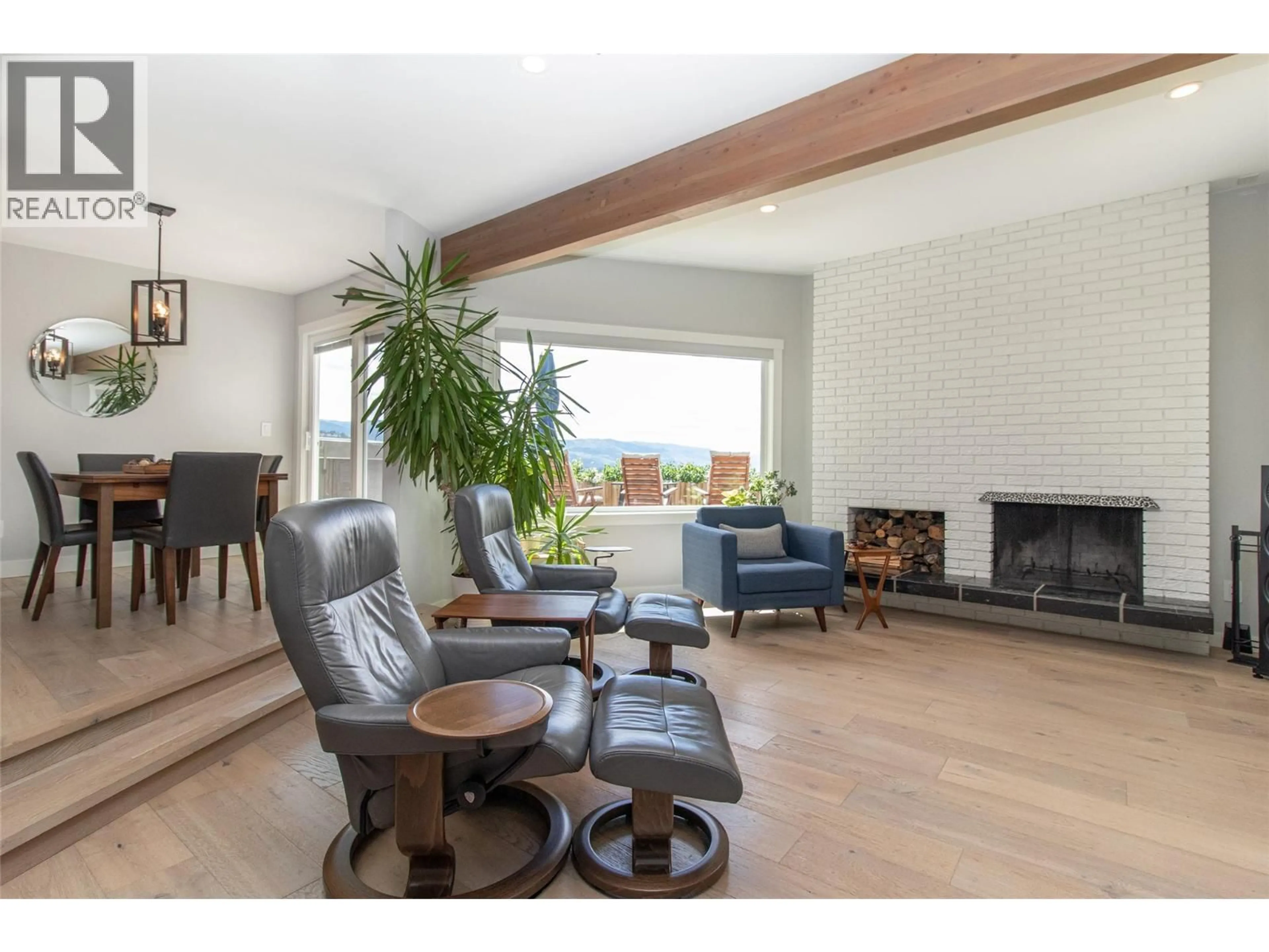 Living room with furniture, wood/laminate floor for 1716 CATHY COURT, Kelowna British Columbia V1P1L4