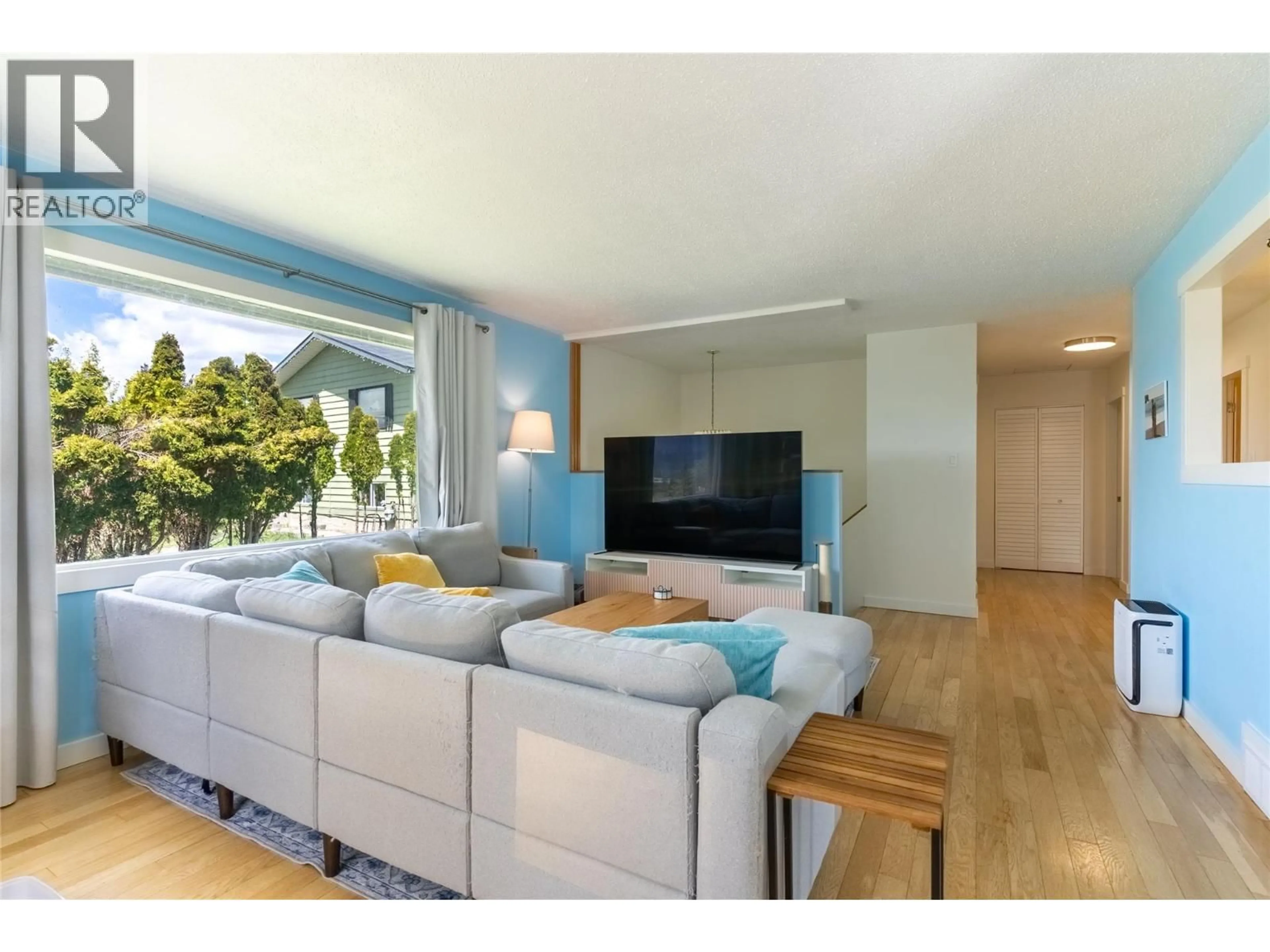 Living room with furniture, wood/laminate floor for 9 JASPER DRIVE, Logan Lake British Columbia V0K1W0