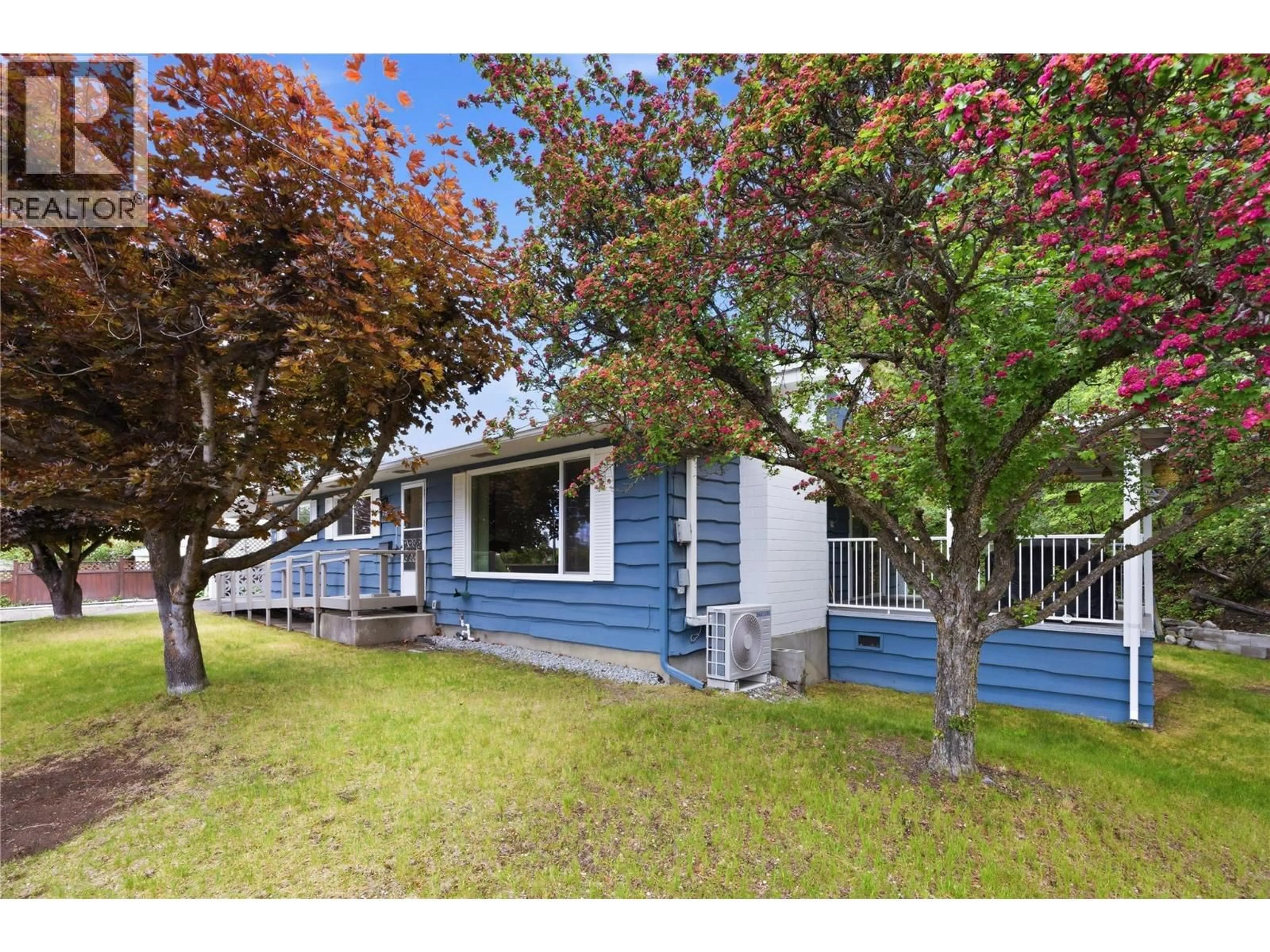 A pic from outside/outdoor area/front of a property/back of a property/a pic from drone, street for 1280 DEBECK ROAD, Penticton British Columbia V2A3Z4