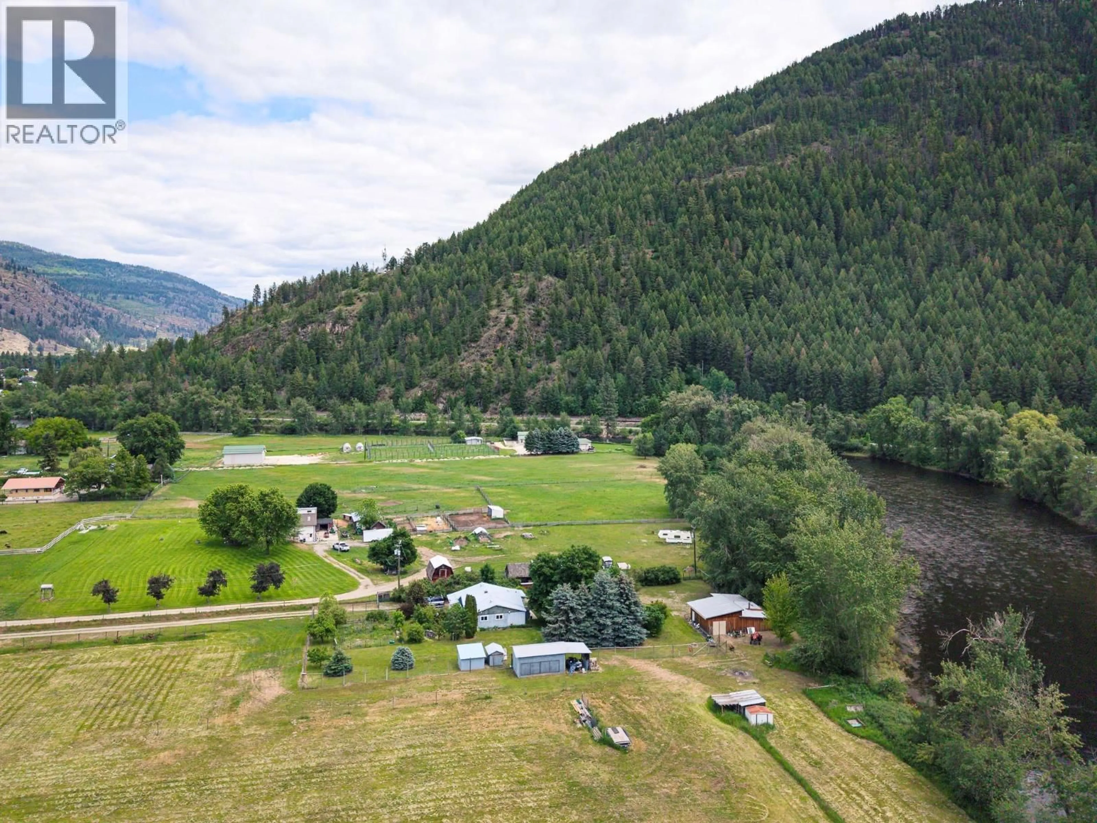 A pic from outside/outdoor area/front of a property/back of a property/a pic from drone, mountain view for 460 SOUTH NURSERY ROAD, Grand Forks British Columbia V0H1H9