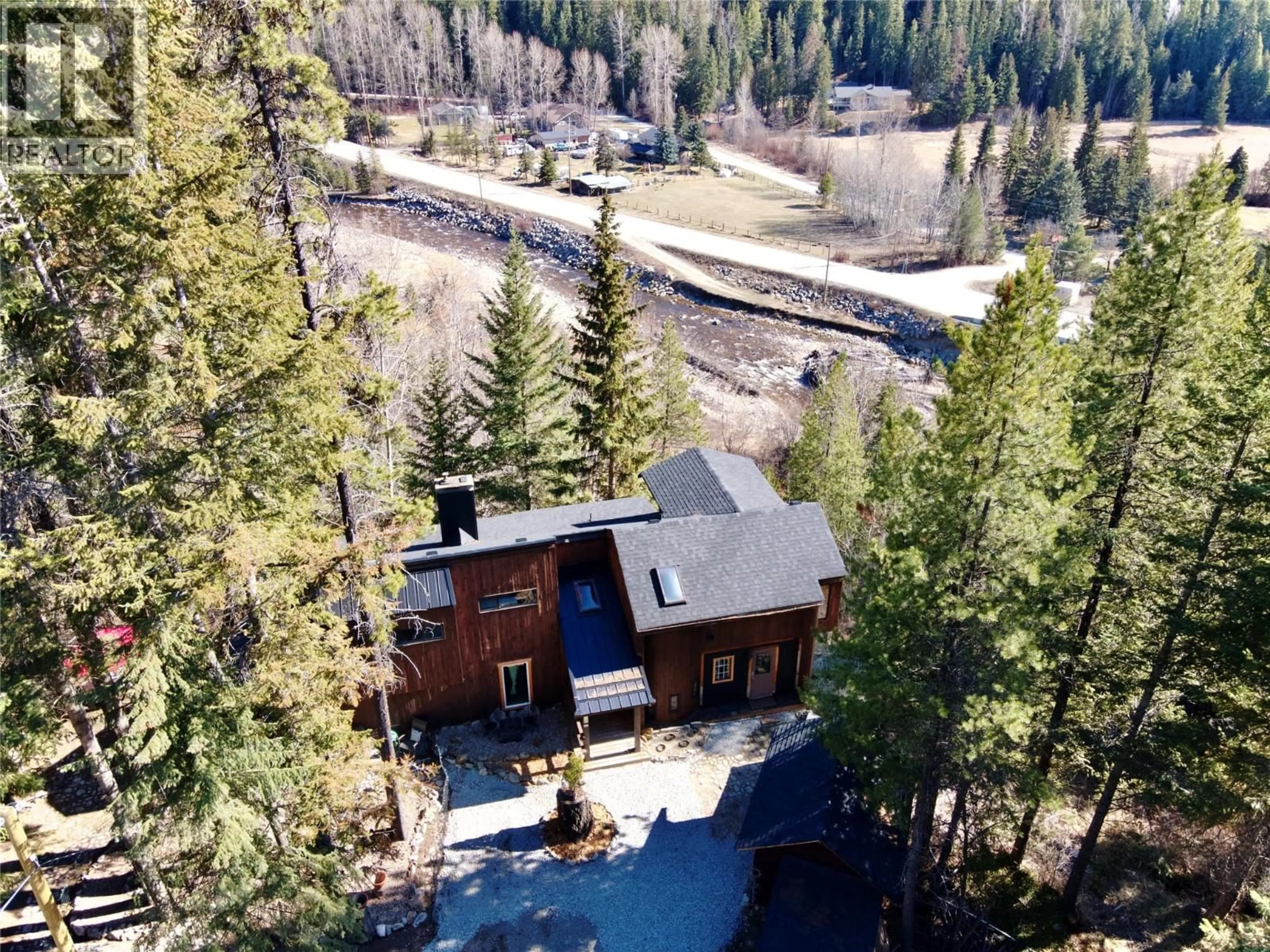 A pic from outside/outdoor area/front of a property/back of a property/a pic from drone, forest/trees view for 11251 THREE FORKS ROAD, Kelowna British Columbia V1P1J8