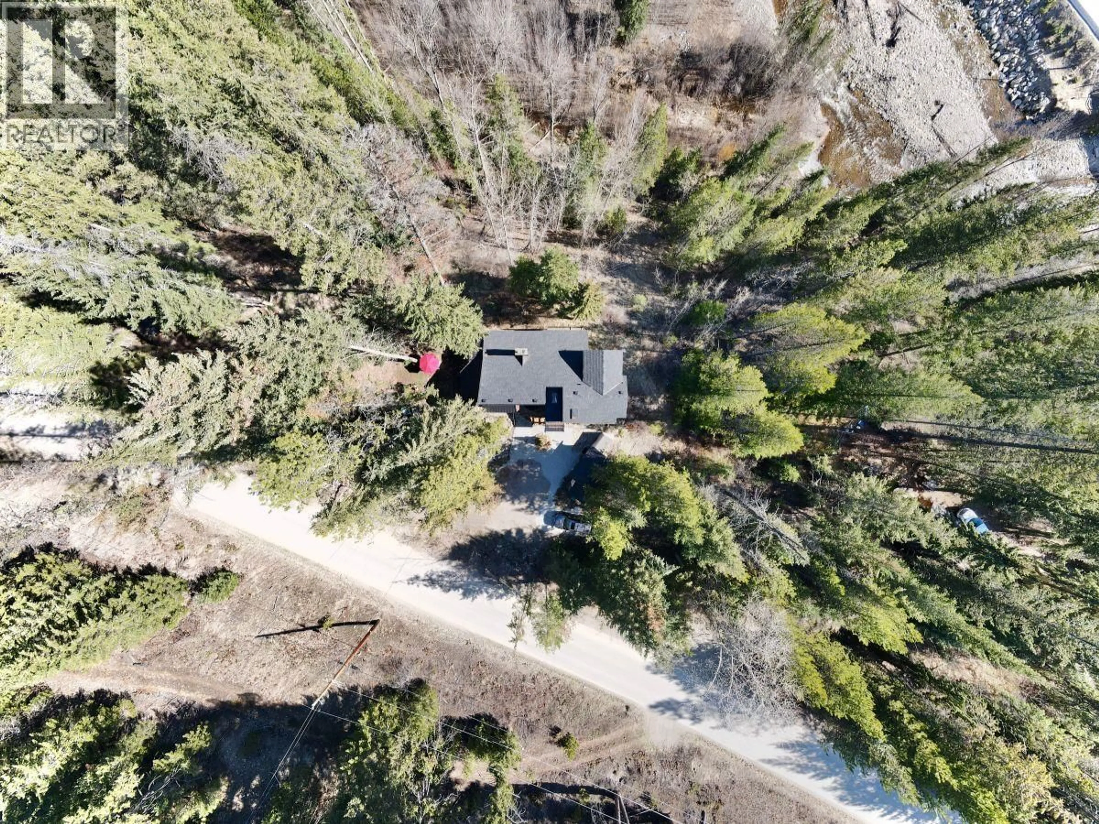 A pic from outside/outdoor area/front of a property/back of a property/a pic from drone, forest/trees view for 11251 THREE FORKS ROAD, Kelowna British Columbia V1P1J8