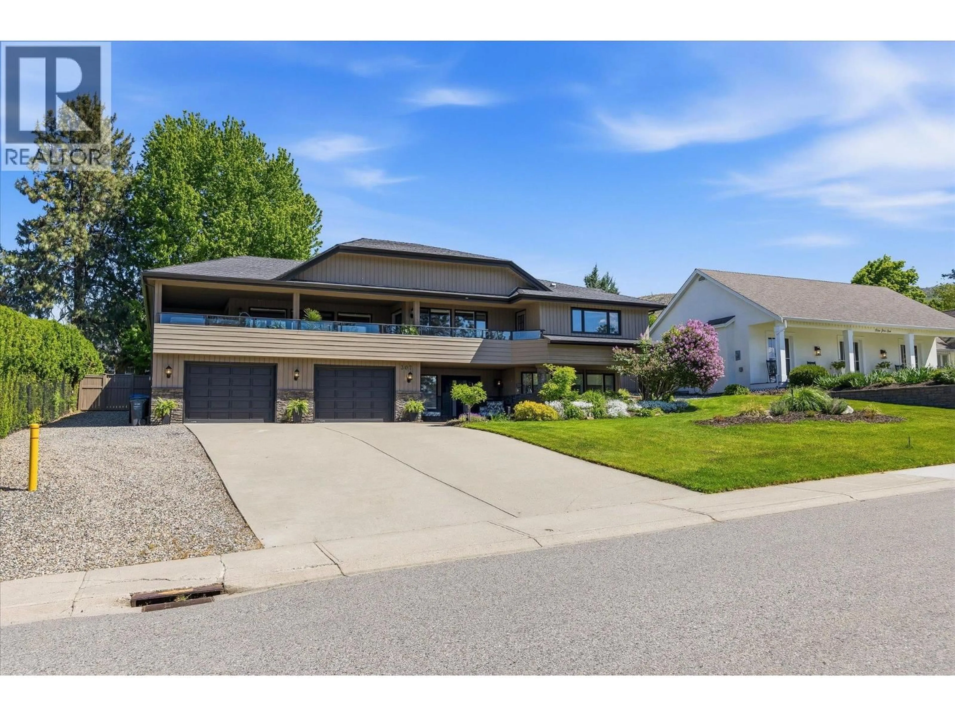 Home with vinyl exterior material, street for 307 STELLAR DRIVE, Kelowna British Columbia V1W4K5